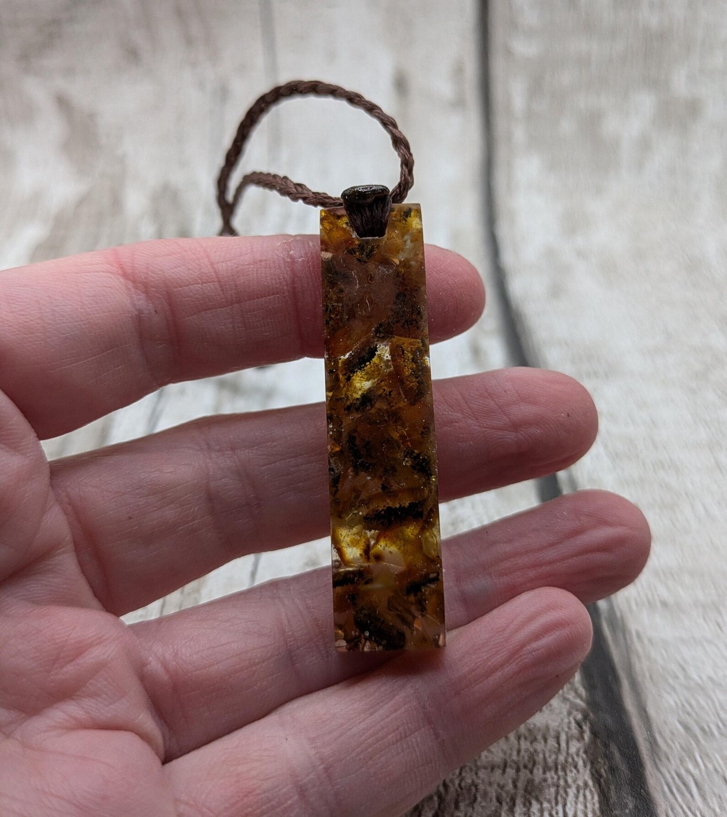 Baltic Amber and copper in resin pendant.