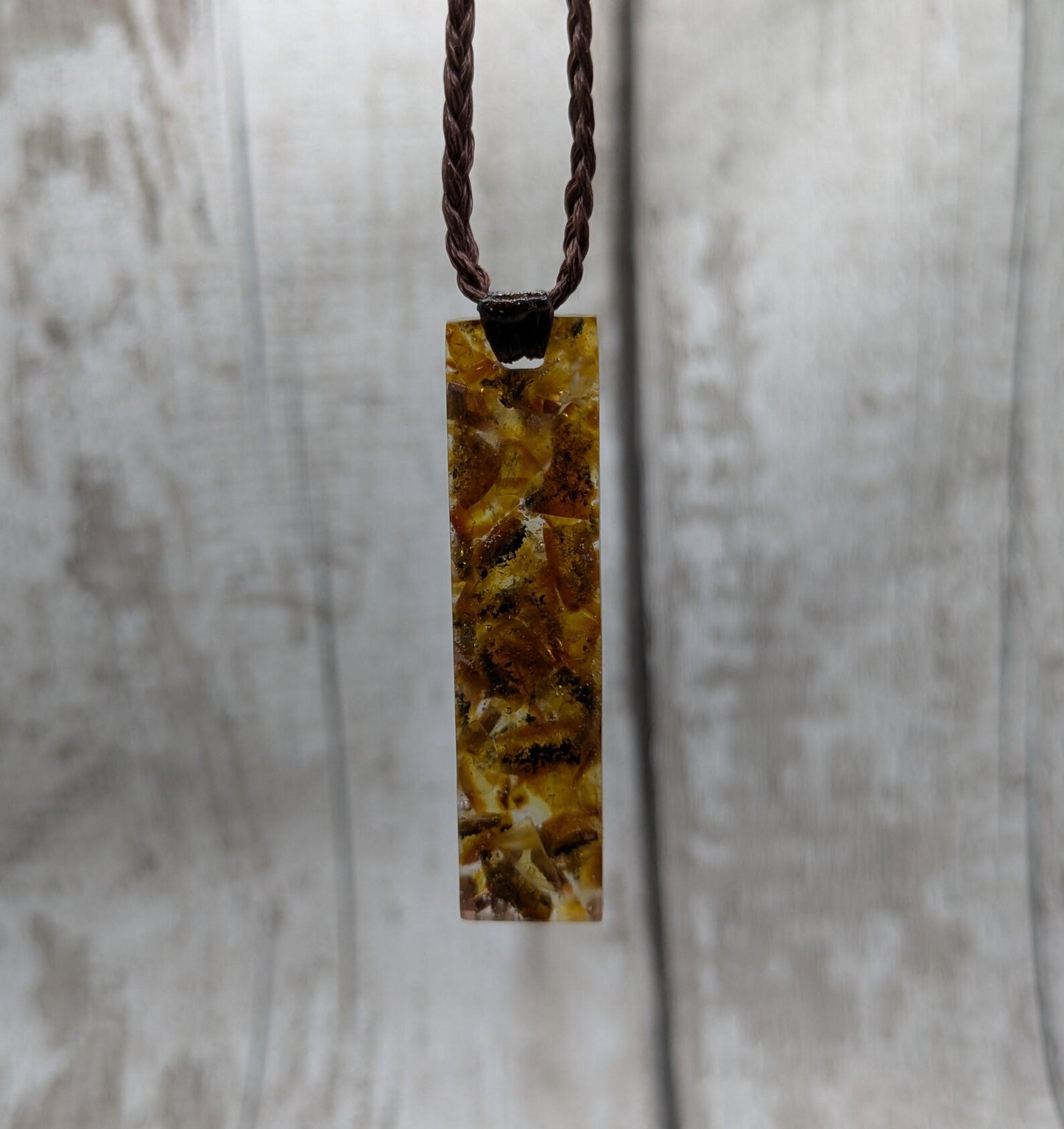 Baltic Amber and copper in resin pendant.