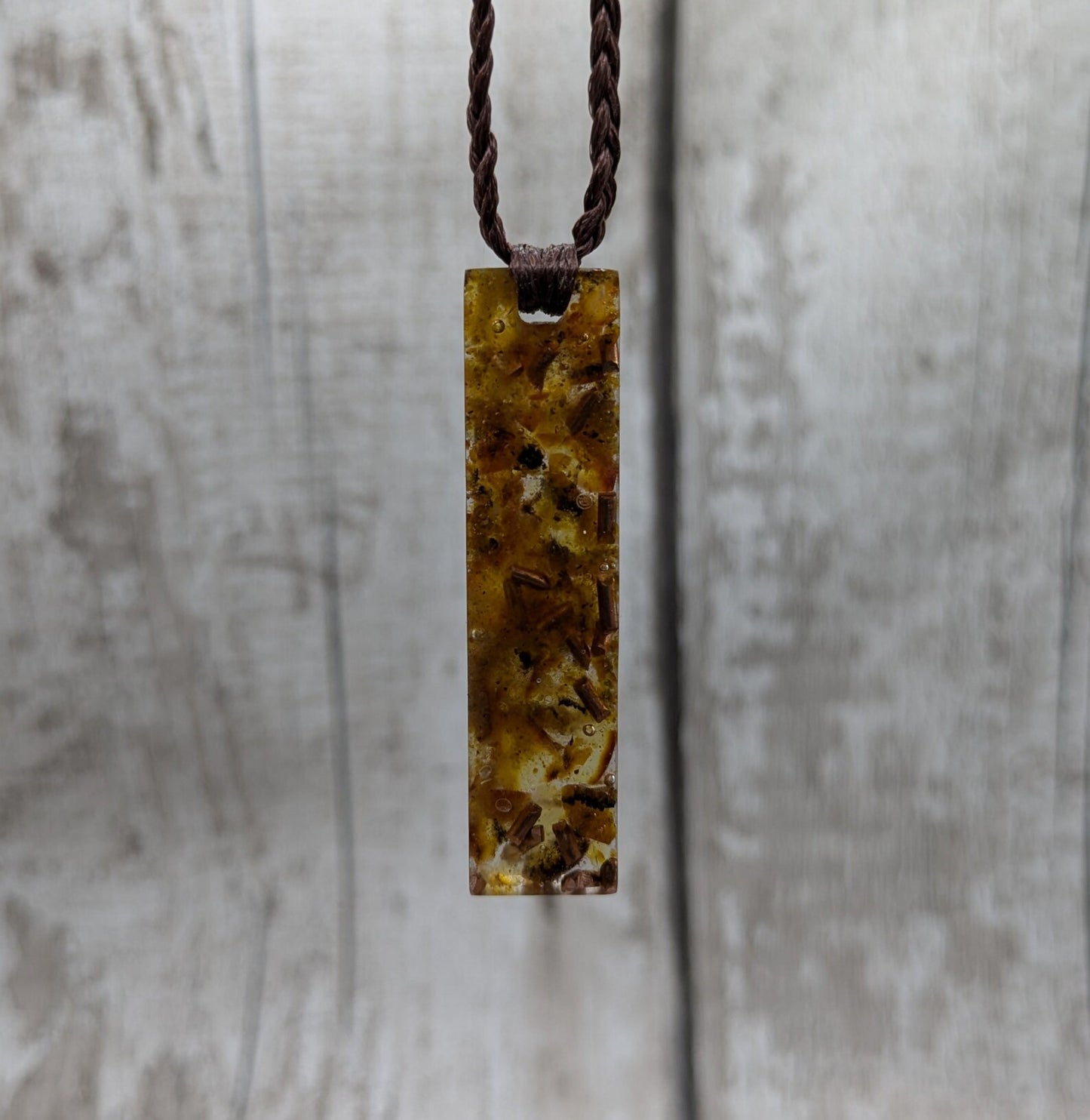 Baltic Amber and copper in resin pendant.