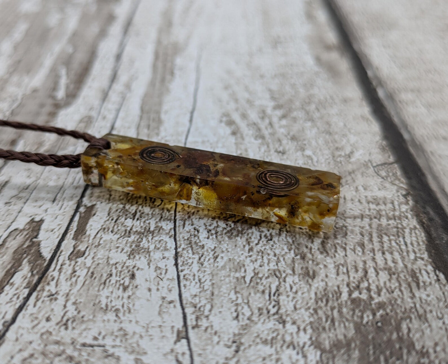 Baltic Amber and copper in resin pendant.