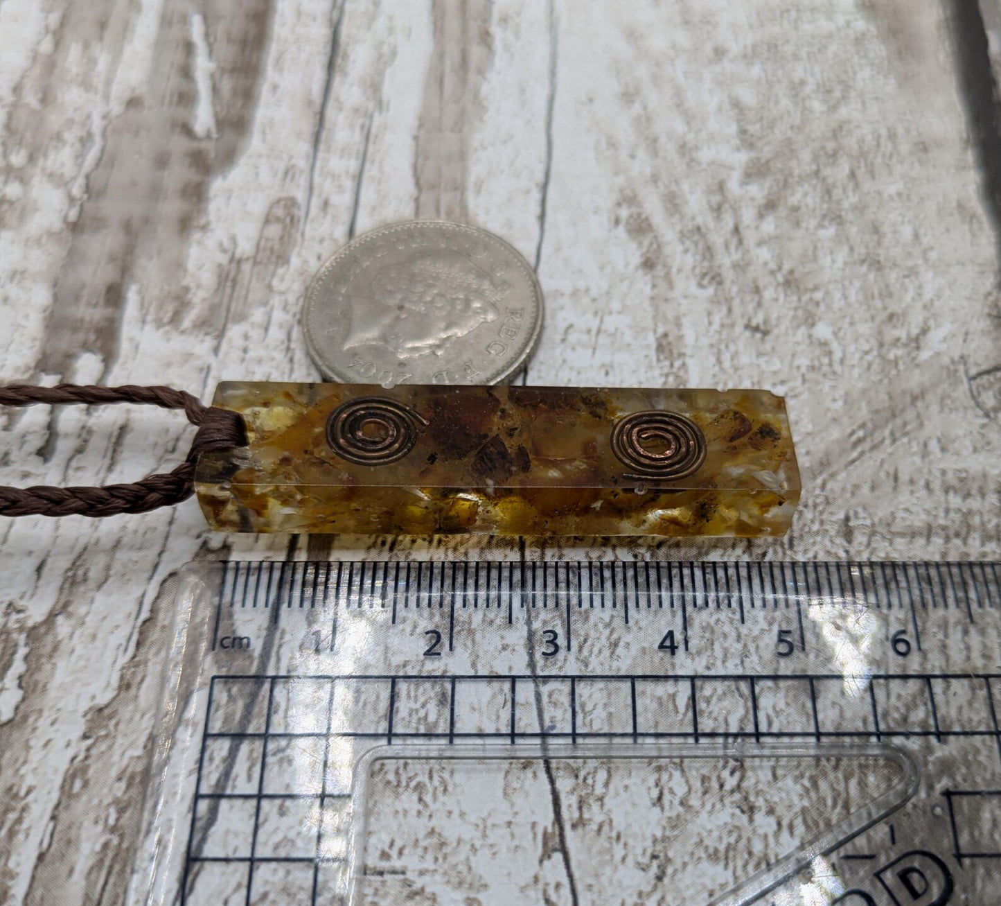 Baltic Amber and copper in resin pendant.