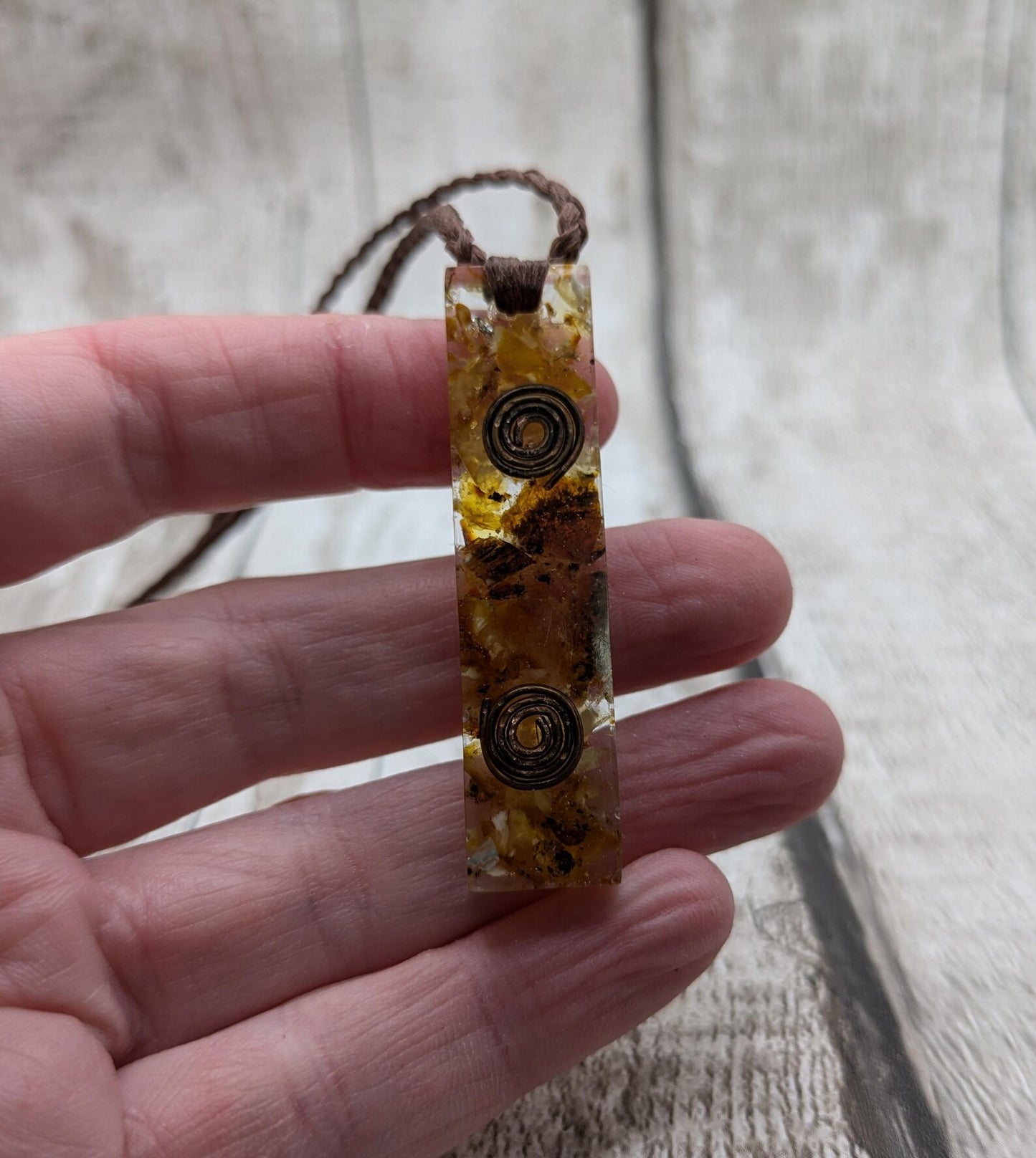 Baltic Amber and copper in resin pendant.