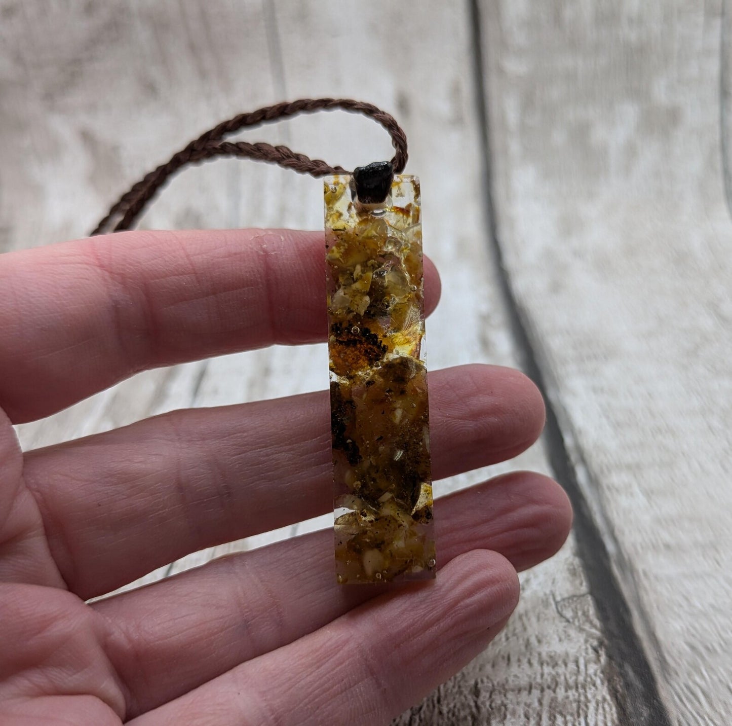 Baltic Amber and copper in resin pendant.