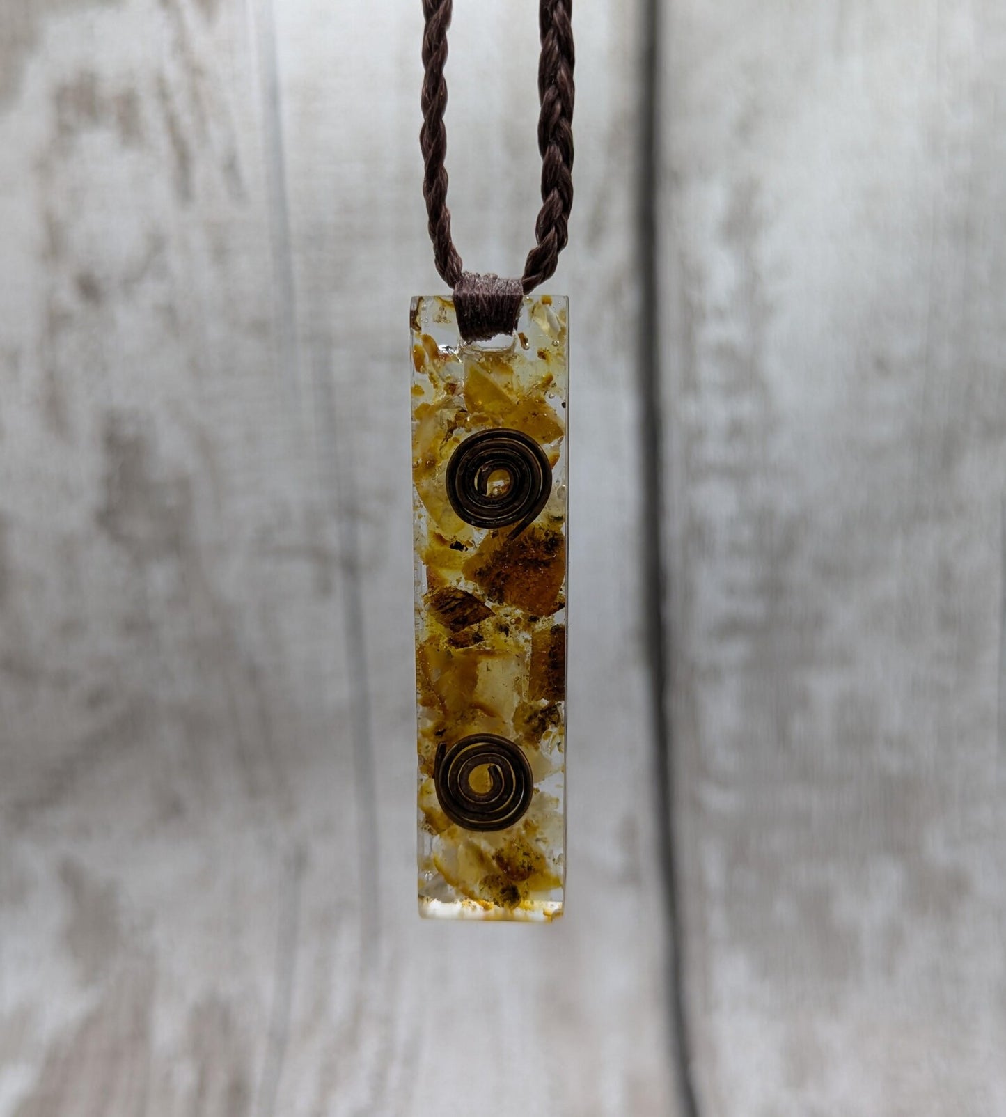 Baltic Amber and copper in resin pendant.