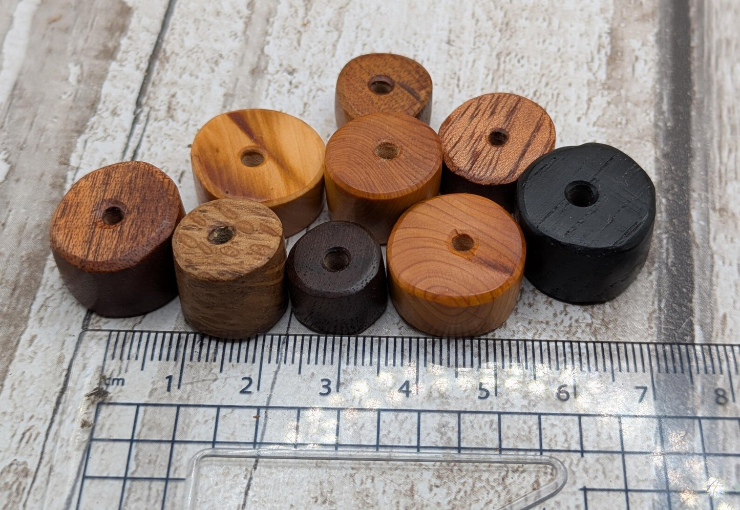 10 mixed random wooden tube beads.