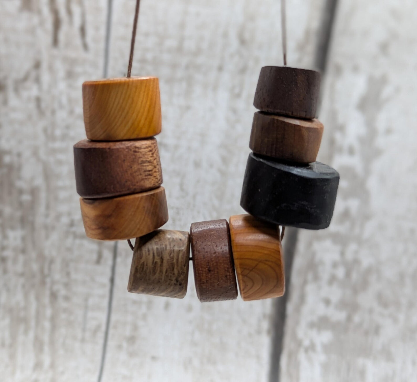10 mixed random wooden tube beads.
