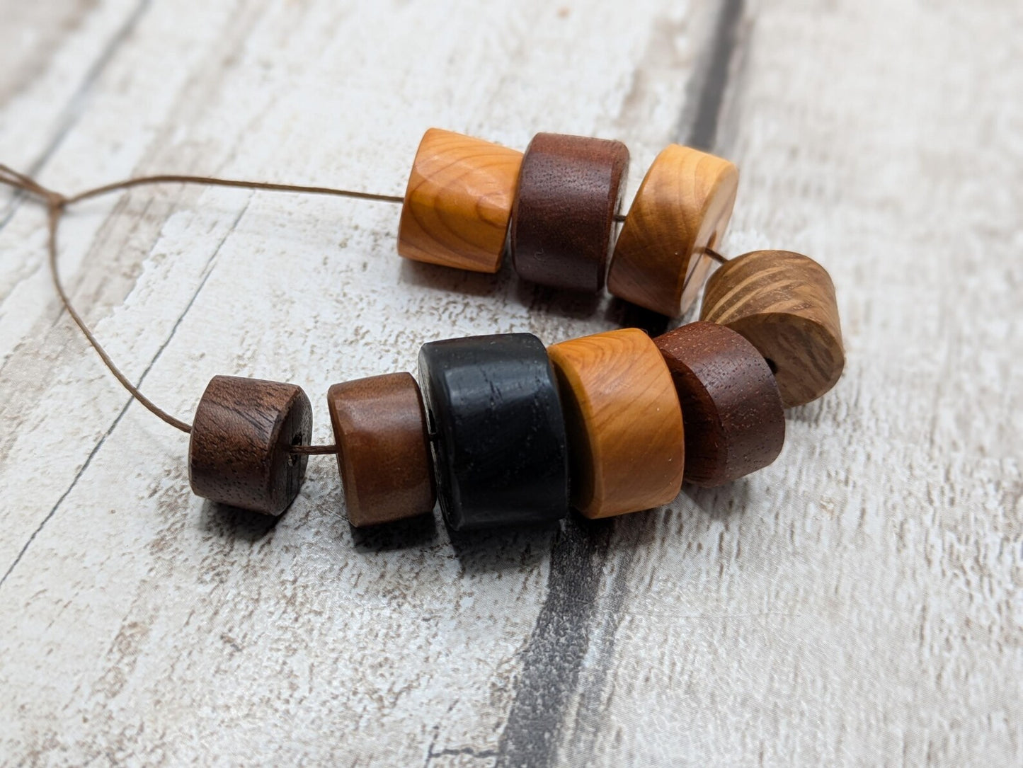 10 mixed random wooden tube beads.