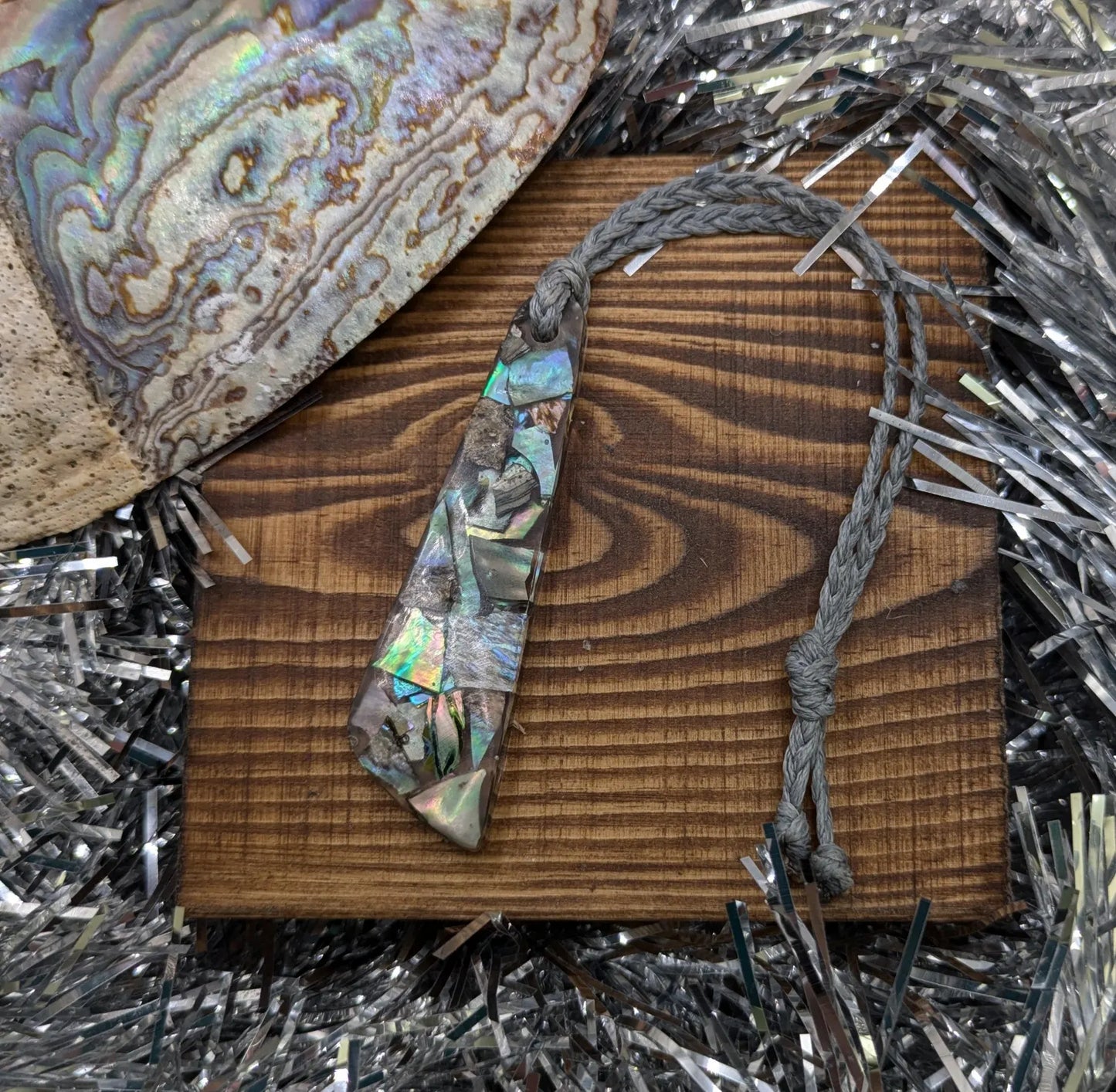 New Zealand rainbow pāua shell hanging decoration.