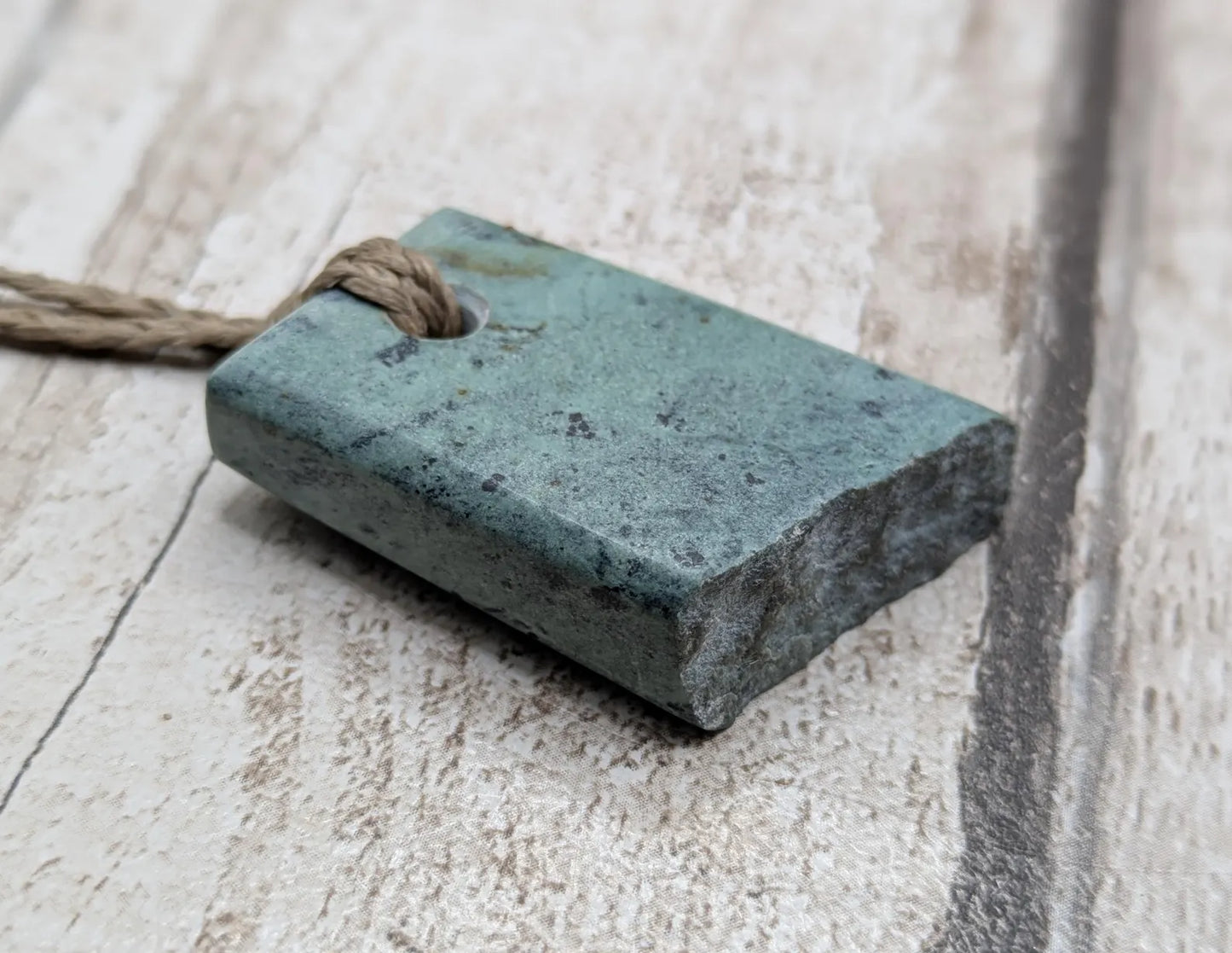 New Zealand pounamu Greenstone offcut raw edged pendant.