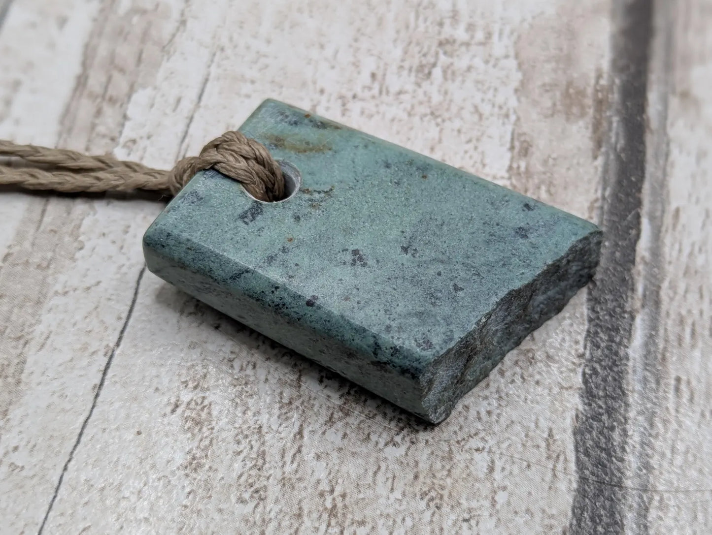 New Zealand pounamu Greenstone offcut raw edged pendant.