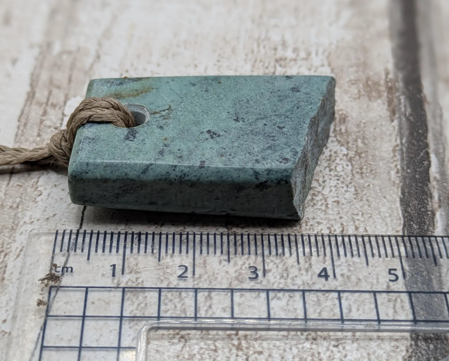 New Zealand pounamu Greenstone offcut raw edged pendant.