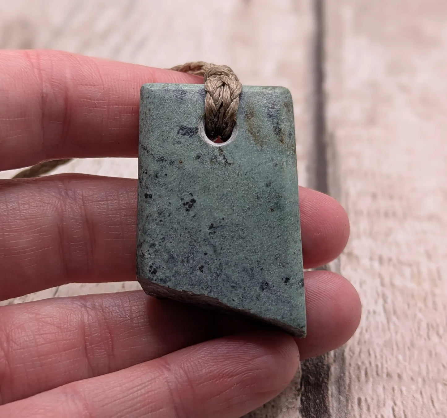 New Zealand pounamu Greenstone offcut raw edged pendant.