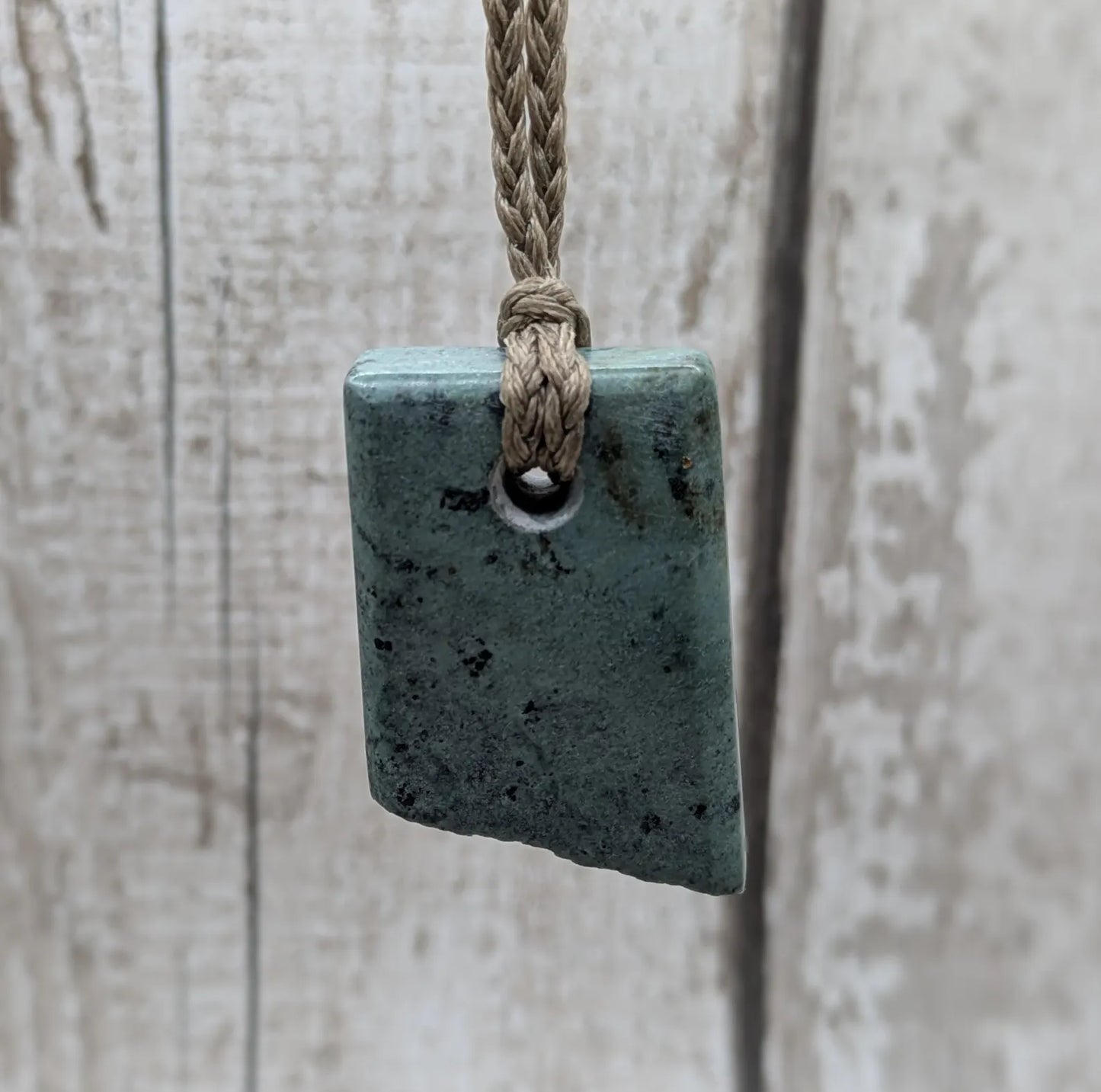 New Zealand pounamu Greenstone offcut raw edged pendant.