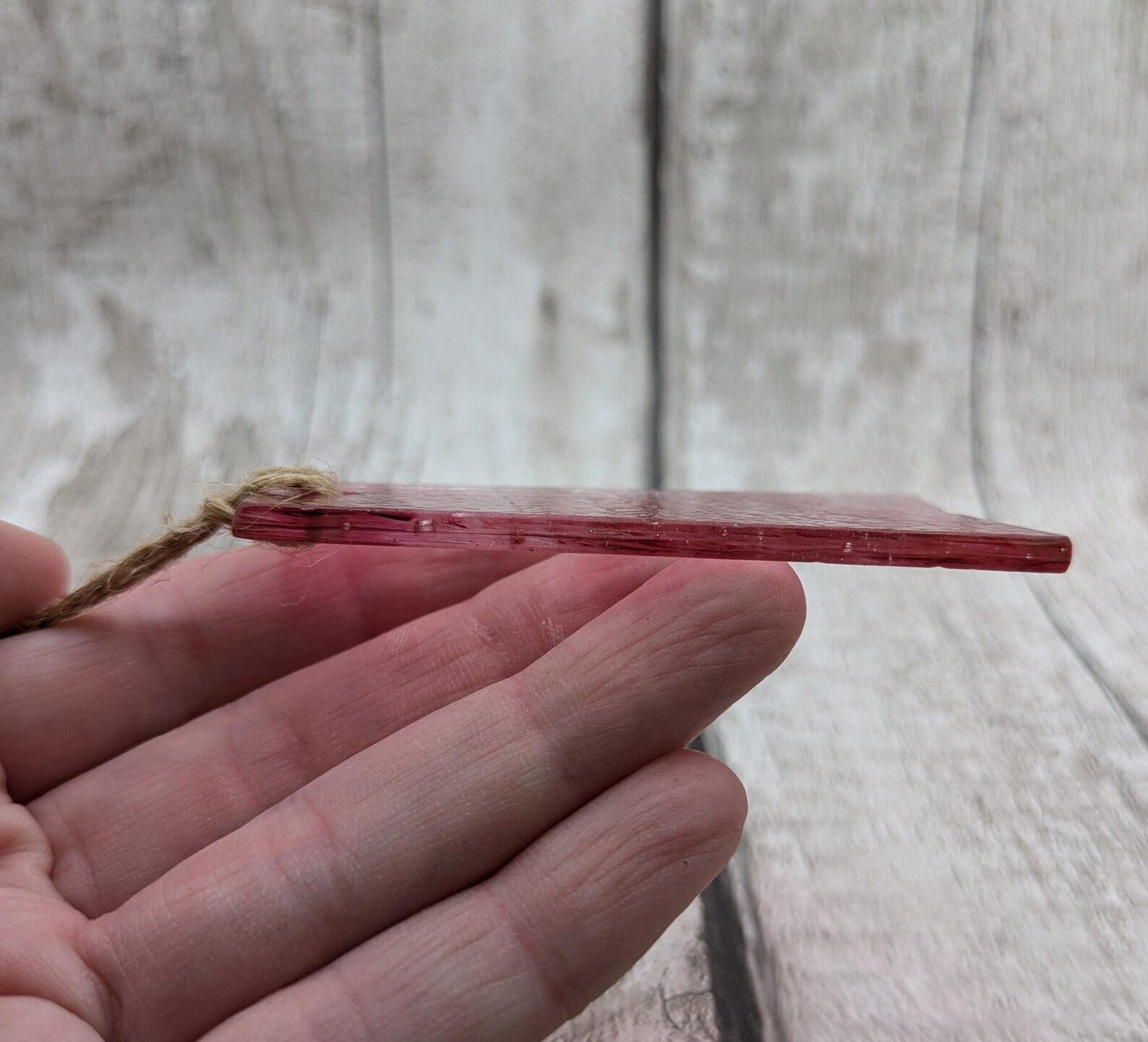 Red recycled stained glass Christmas decoration.