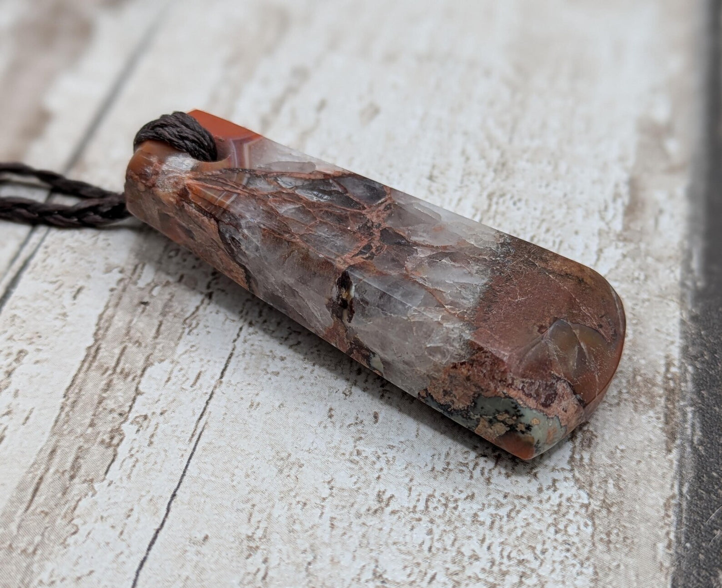 Scottish agate hei toki adze style pendant.