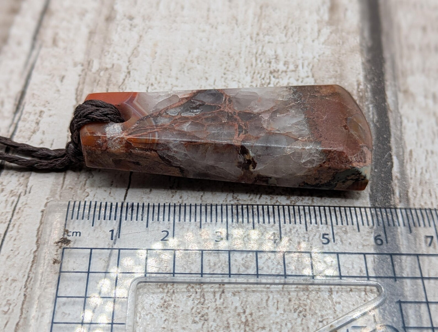 Scottish agate hei toki adze style pendant.