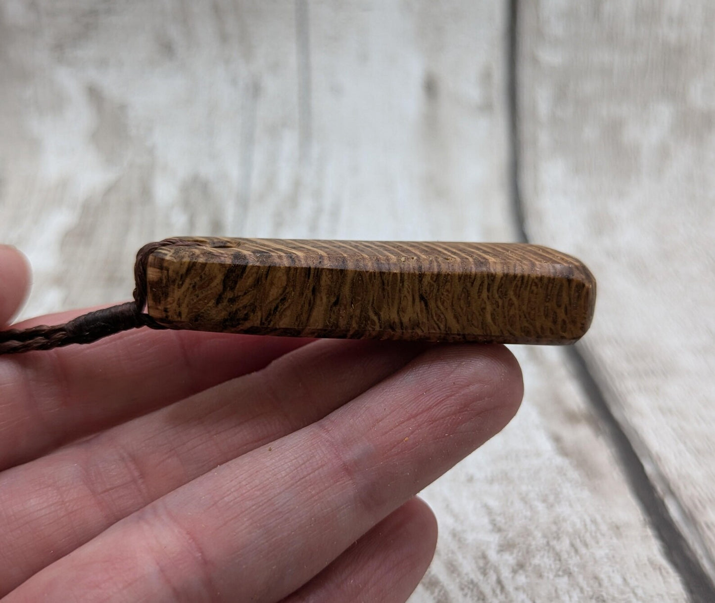 Olive wood roimata teardrop pendant.