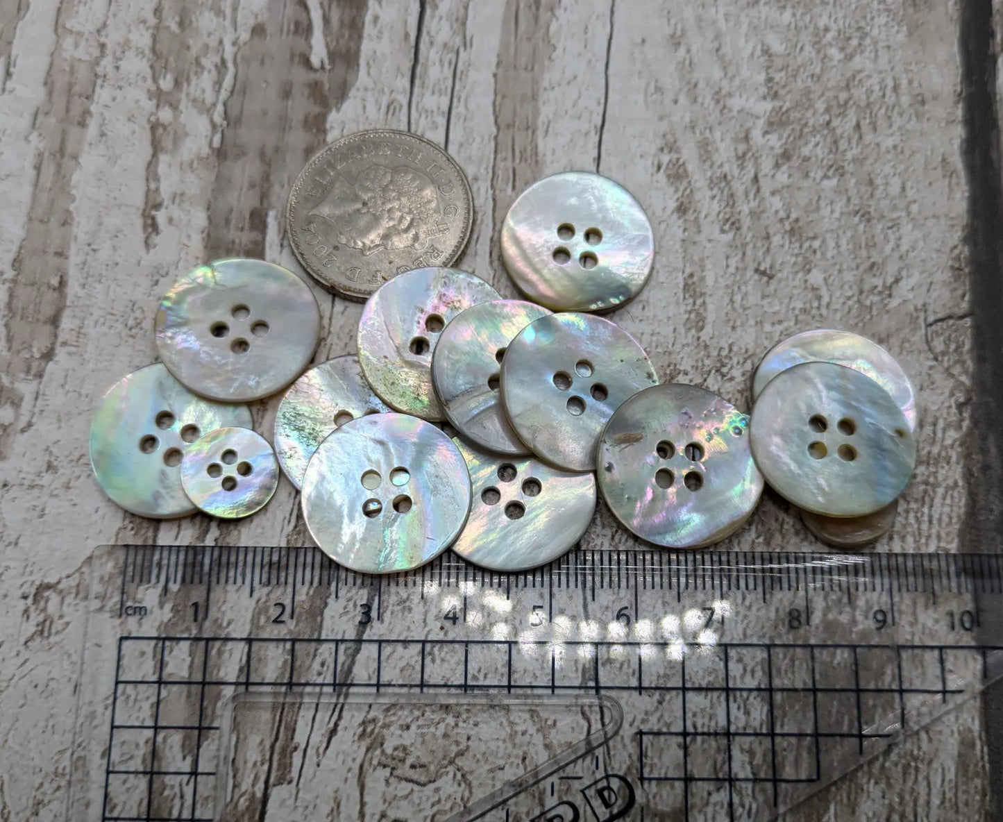 Large abalone shell buttons.