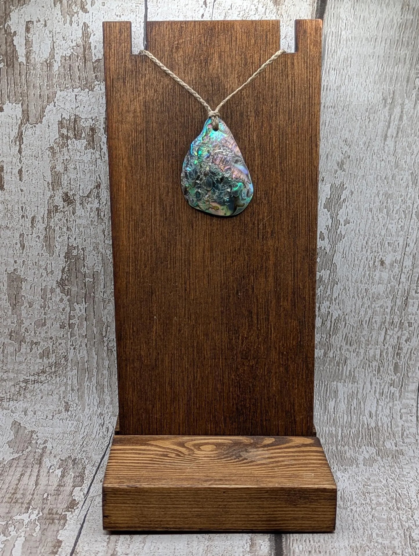 New Zealand free form wild tumbled rainbow Pāua pendant.