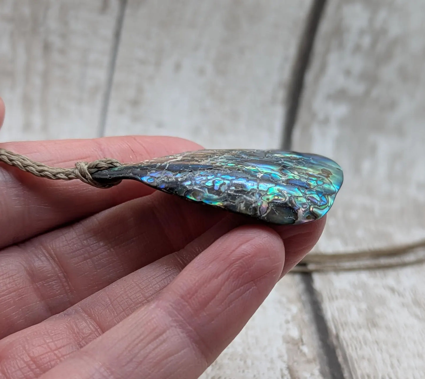 New Zealand free form wild tumbled rainbow Pāua pendant.