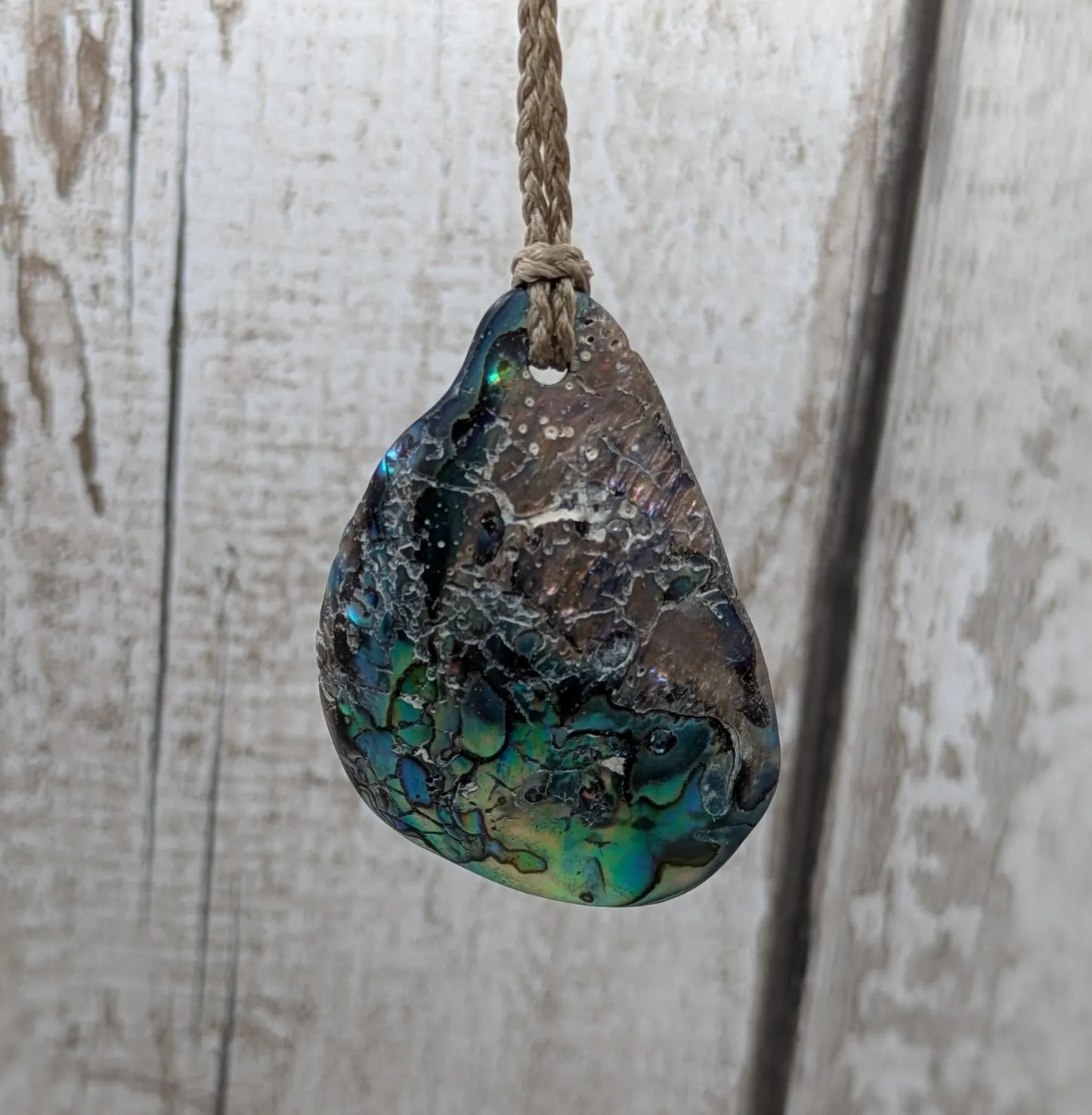 New Zealand free form wild tumbled rainbow Pāua pendant.