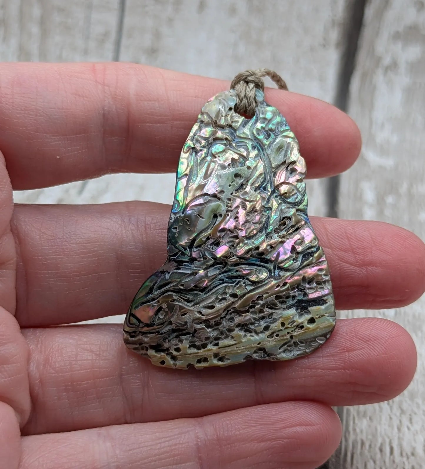 new Zealand Rainbow Pāua naturally tumbled shell pendant