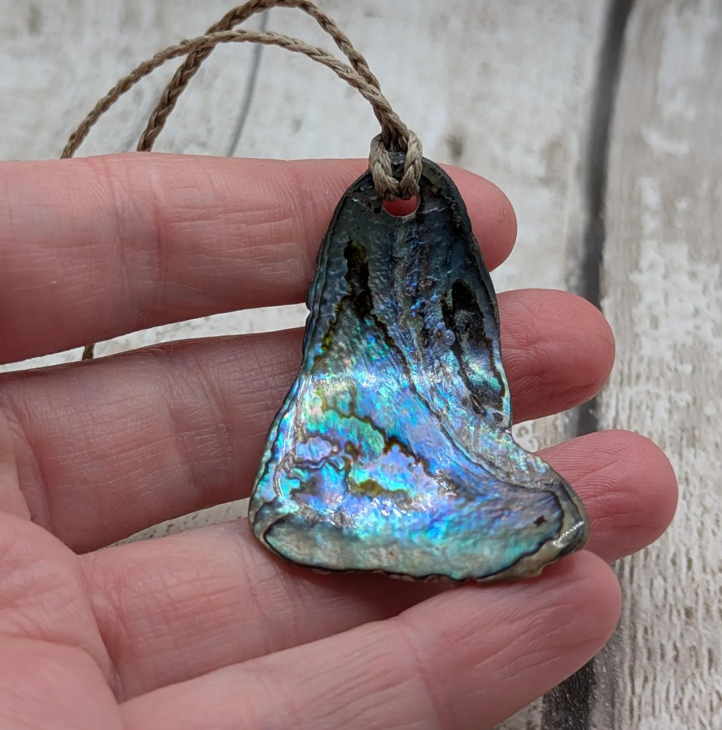 new Zealand Rainbow Pāua naturally tumbled shell pendant
