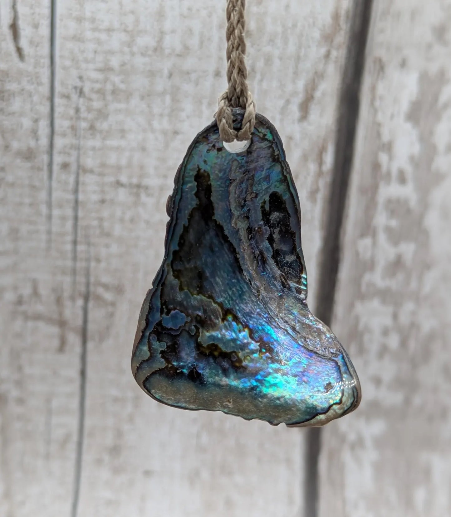 new Zealand Rainbow Pāua naturally tumbled shell pendant