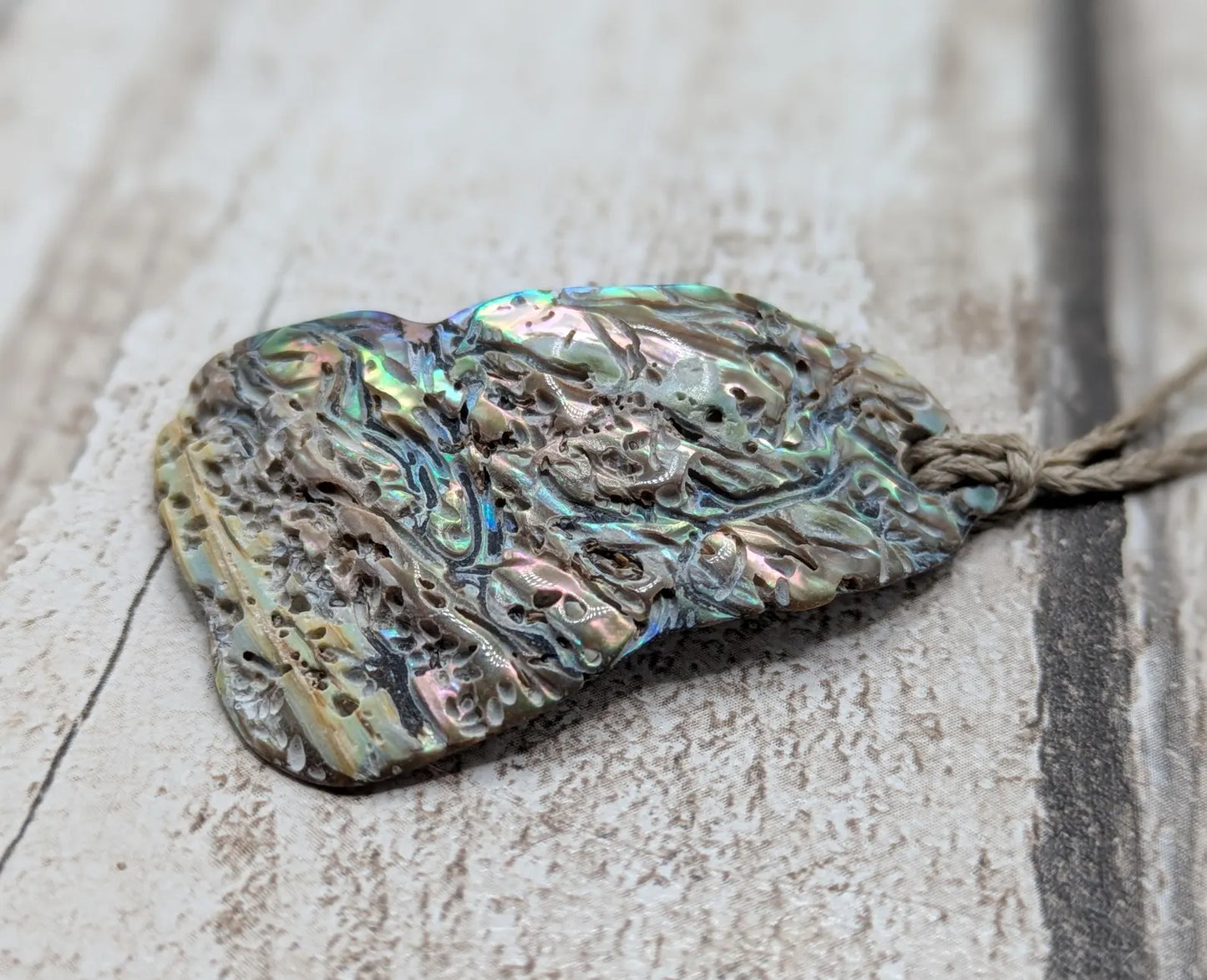 new Zealand Rainbow Pāua naturally tumbled shell pendant