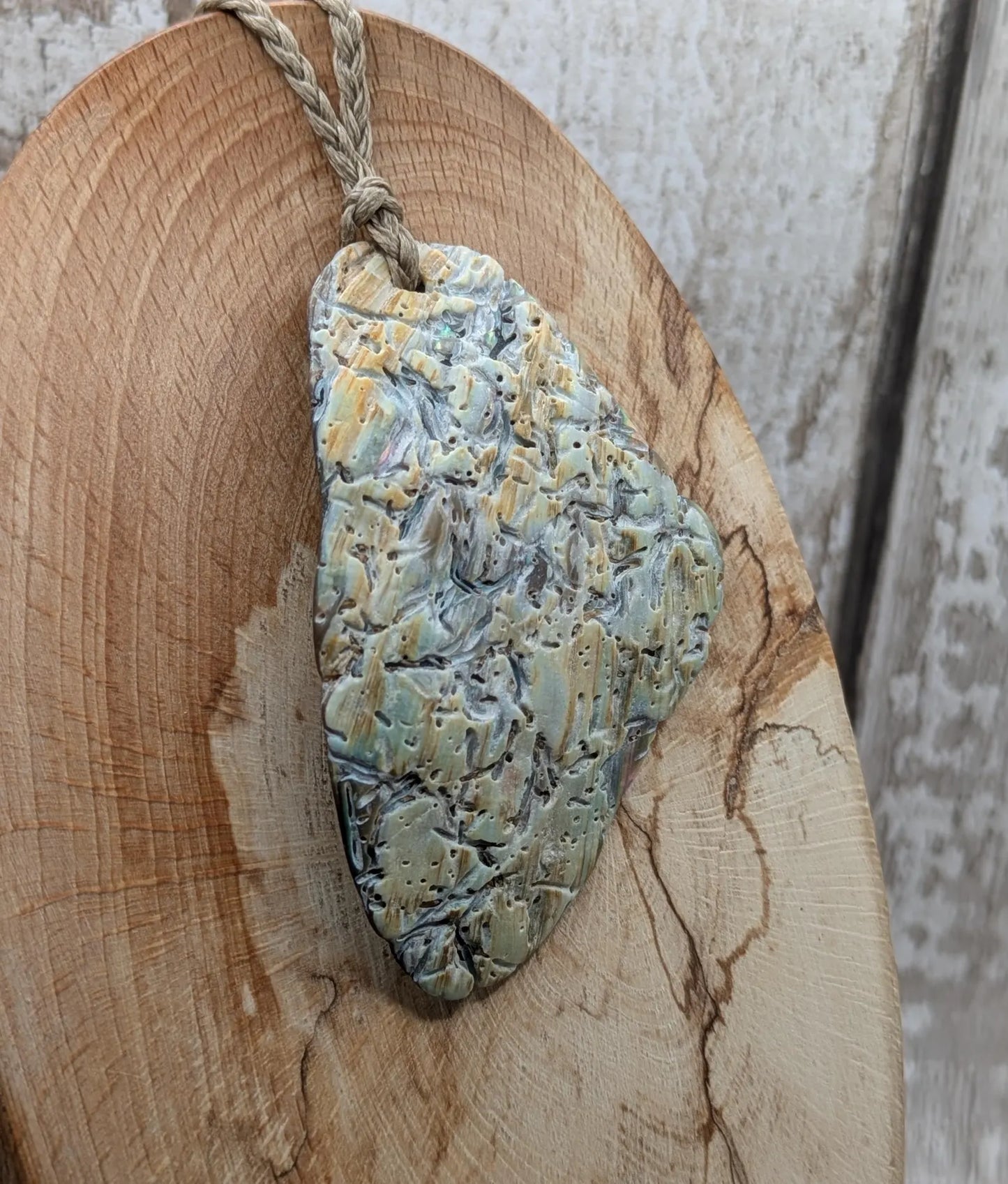 Naturally Tumbled rainbow Pāua abalone shell pendant