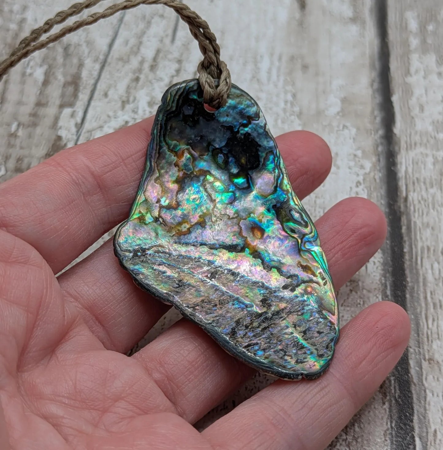 Naturally Tumbled rainbow Pāua abalone shell pendant
