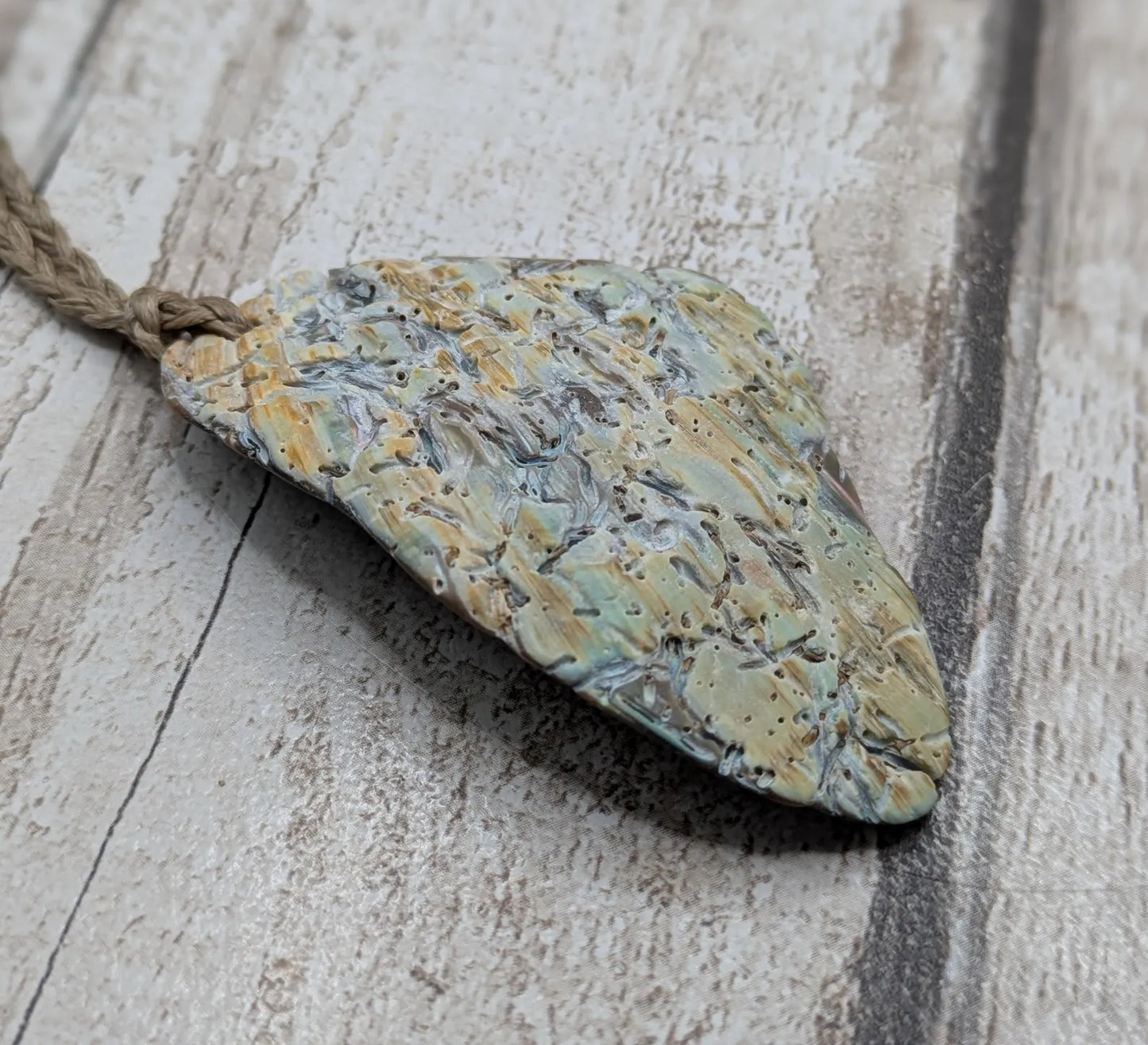 Naturally Tumbled rainbow Pāua abalone shell pendant