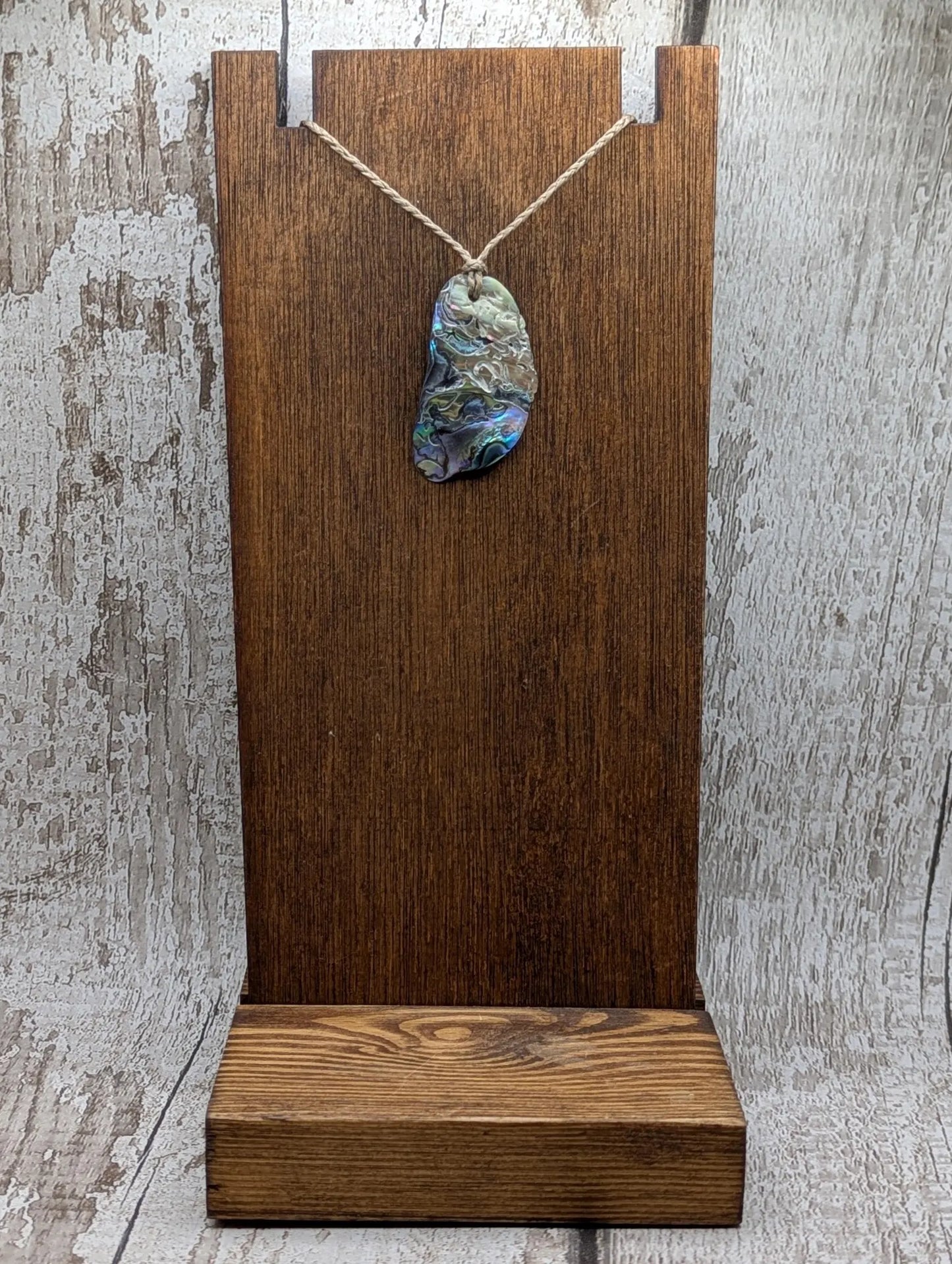 Naturally tumbled New Zealand rainbow Pāua abalone shell pendant