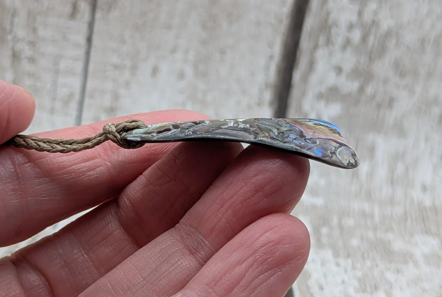 Naturally tumbled New Zealand rainbow Pāua abalone shell pendant