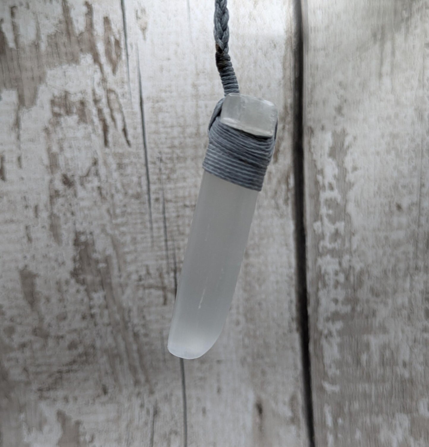 Selenite satin spar Hei Toki adze pendant.