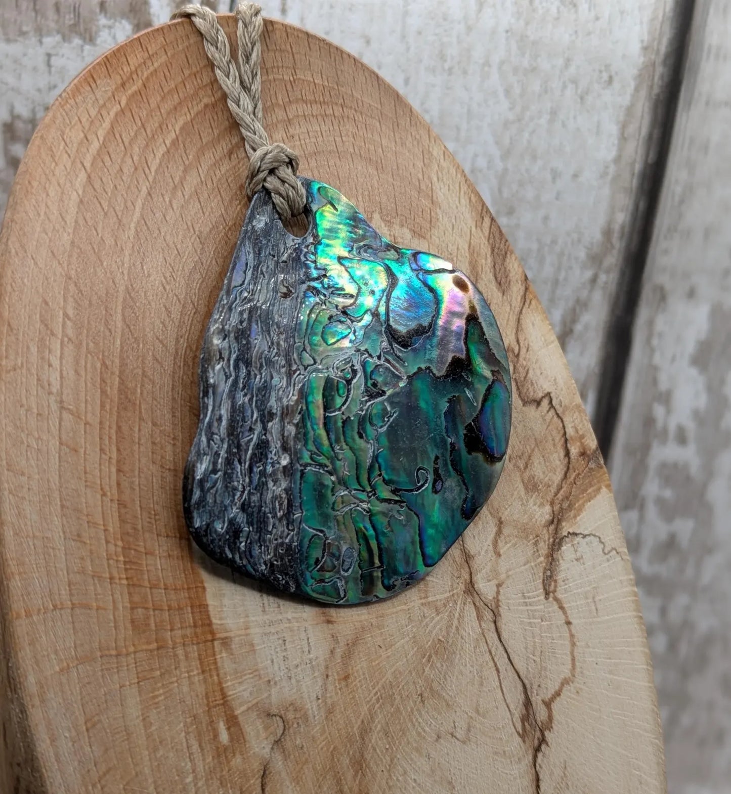 Naturally tumbled New Zealand rainbow Pāua pendant
