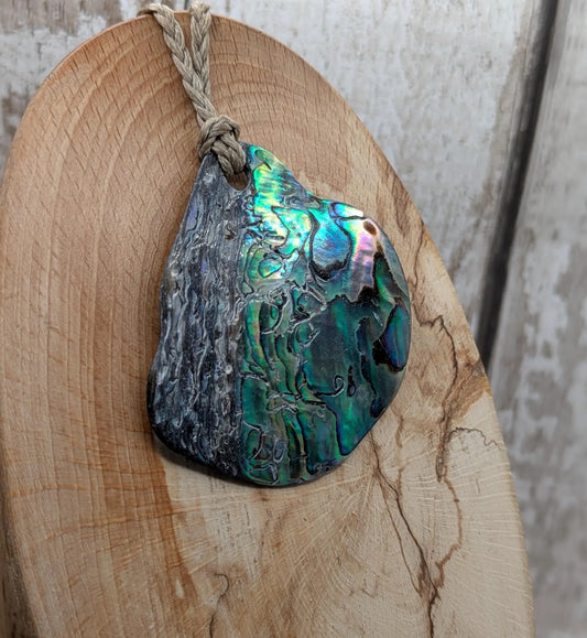 Naturally tumbled New Zealand rainbow Pāua pendant