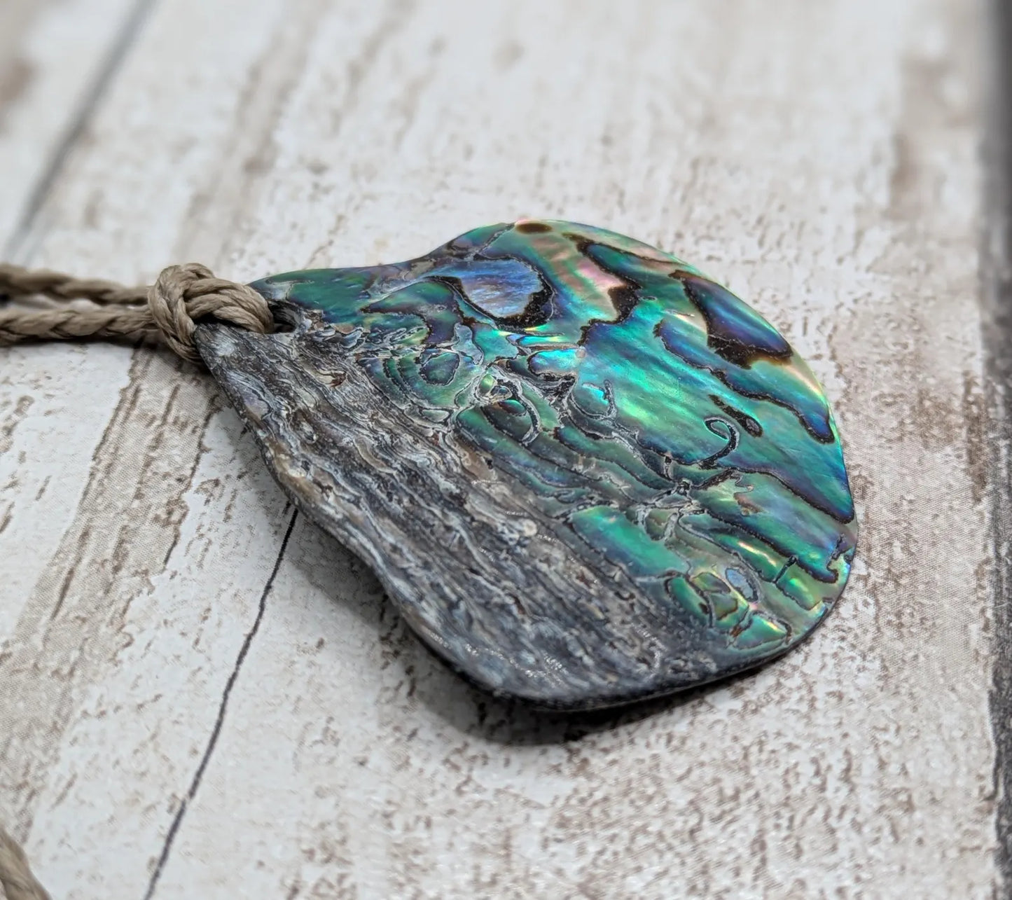 Naturally tumbled New Zealand rainbow Pāua pendant