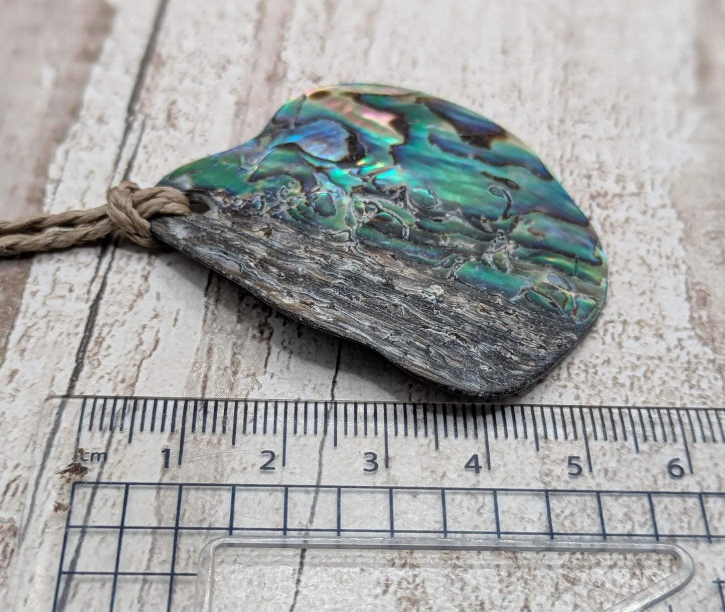 Naturally tumbled New Zealand rainbow Pāua pendant