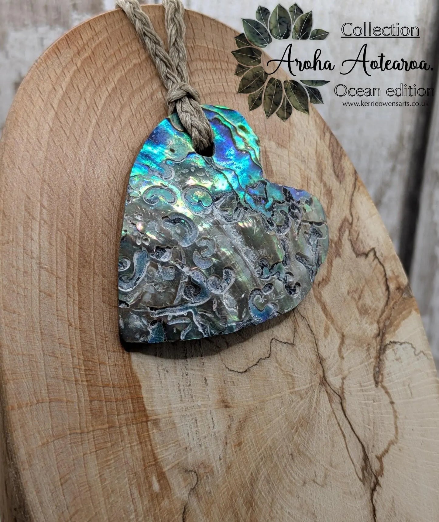 Hand carved New Zealand rainbow Pāua shell heart shaped pendant.