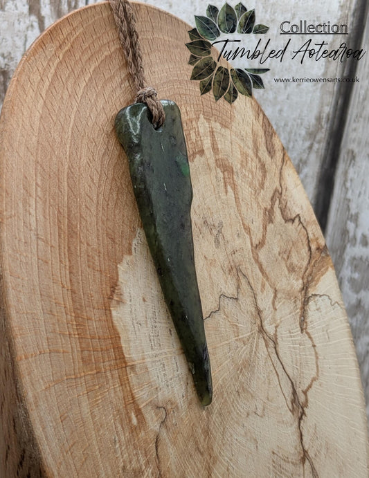 Tumble polished New Zealand Pounamu Jade pendant.