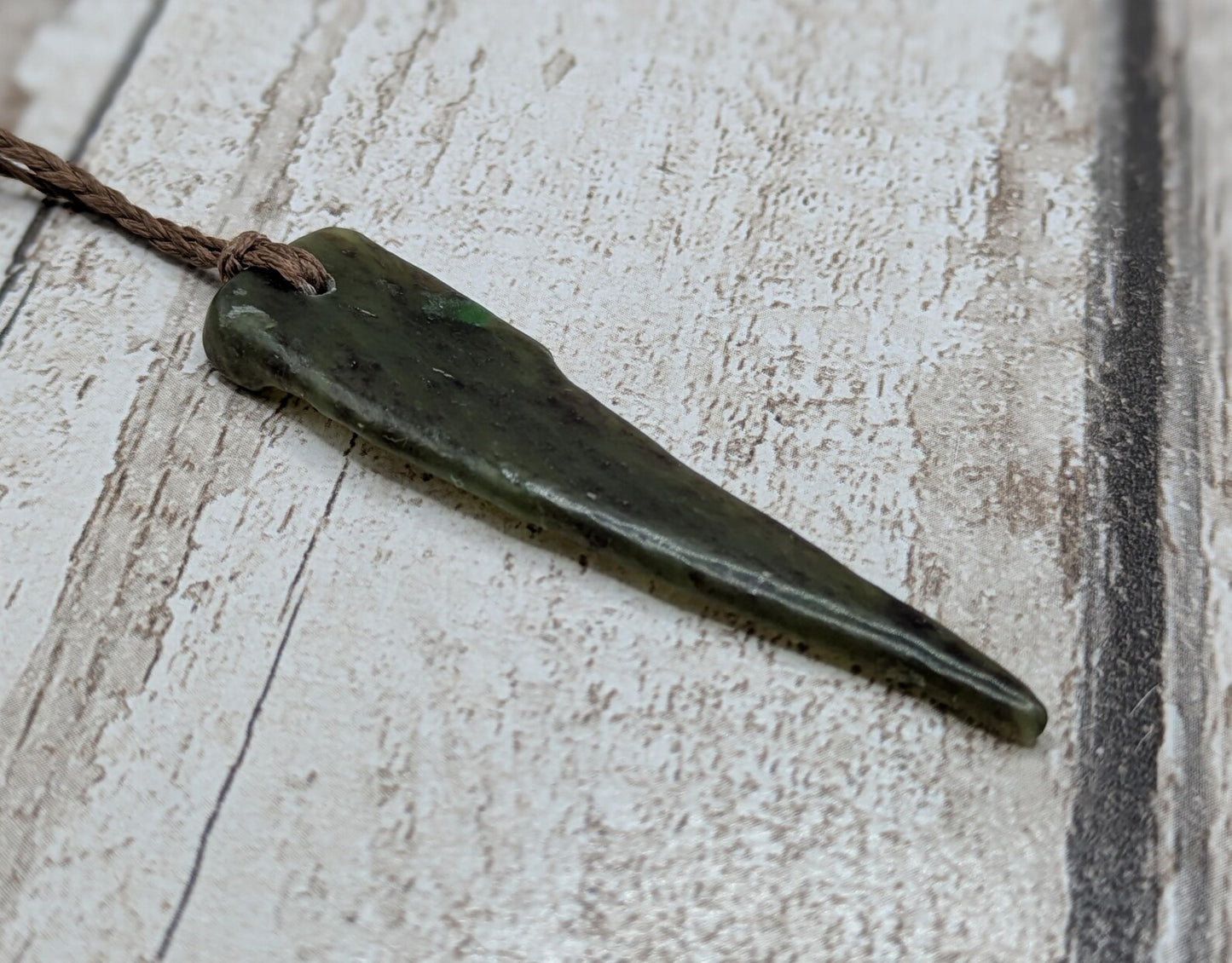 Tumble polished New Zealand Pounamu Jade pendant.