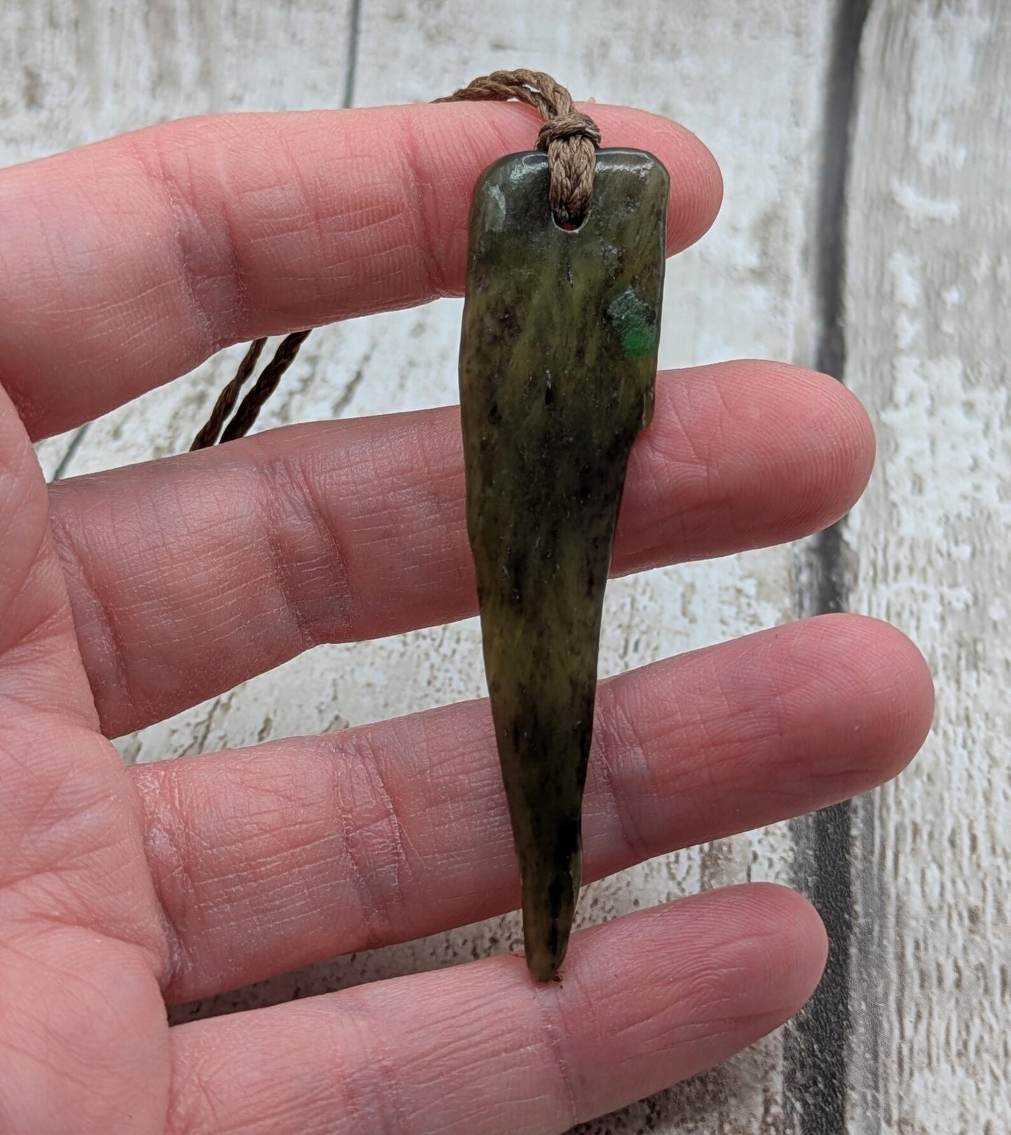 Tumble polished New Zealand Pounamu Jade pendant.