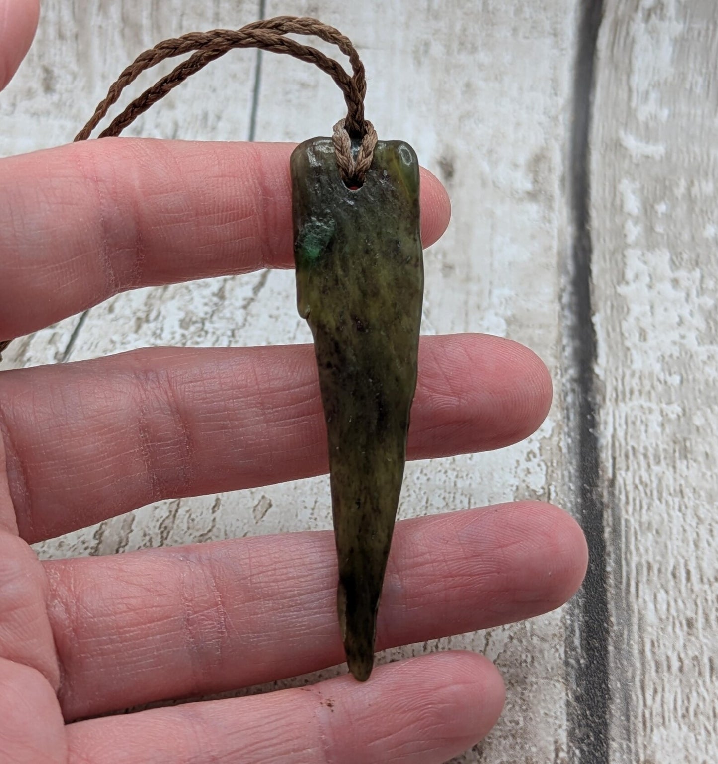 Tumble polished New Zealand Pounamu Jade pendant.