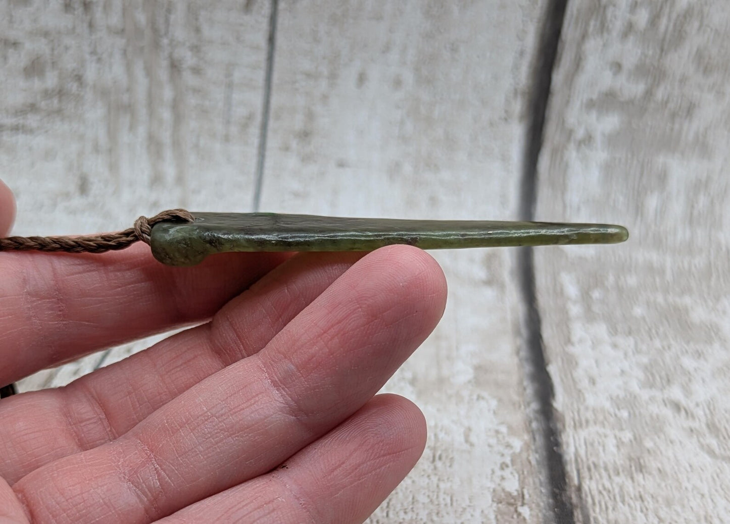 Tumble polished New Zealand Pounamu Jade pendant.