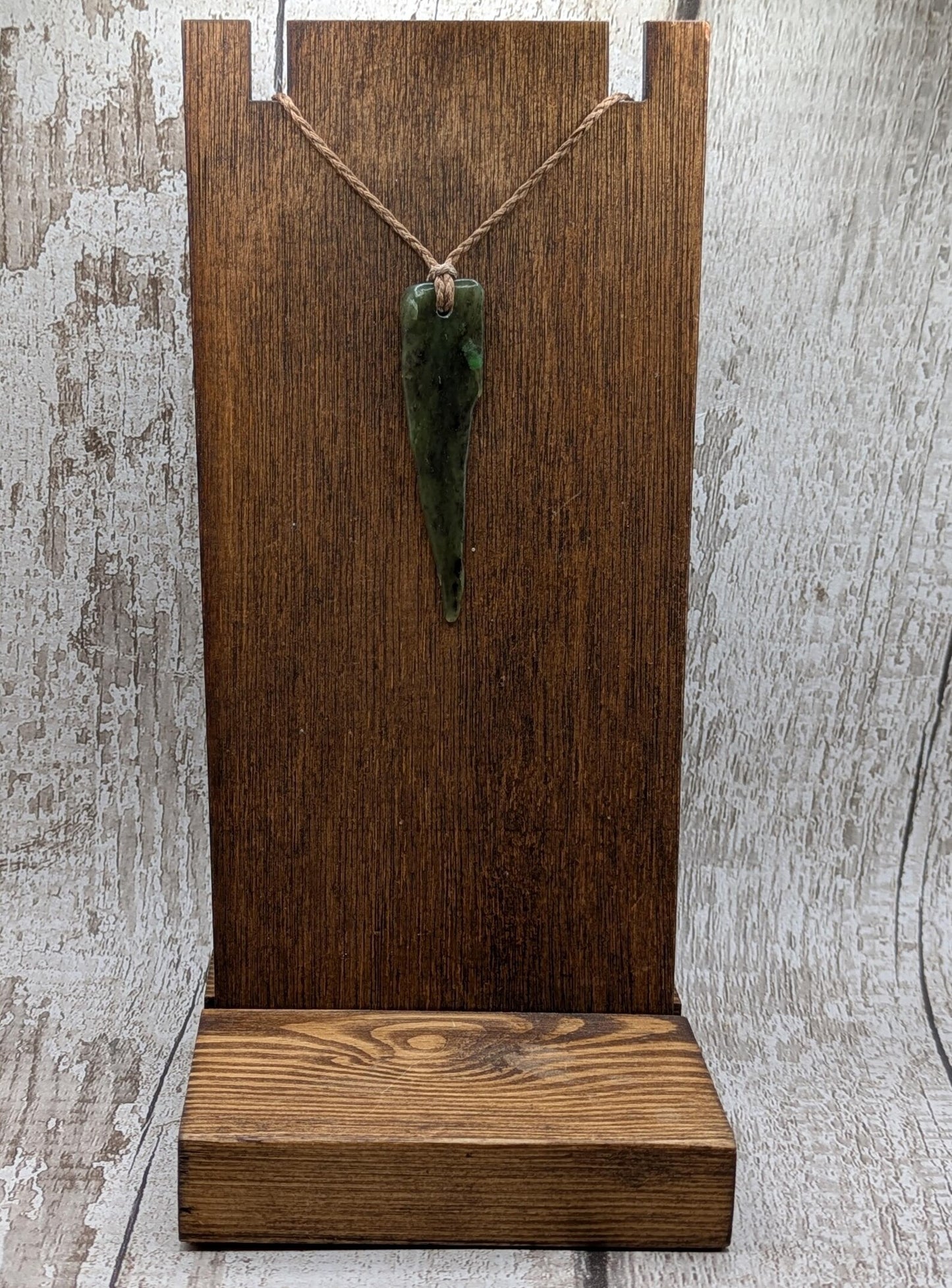 Tumble polished New Zealand Pounamu Jade pendant.