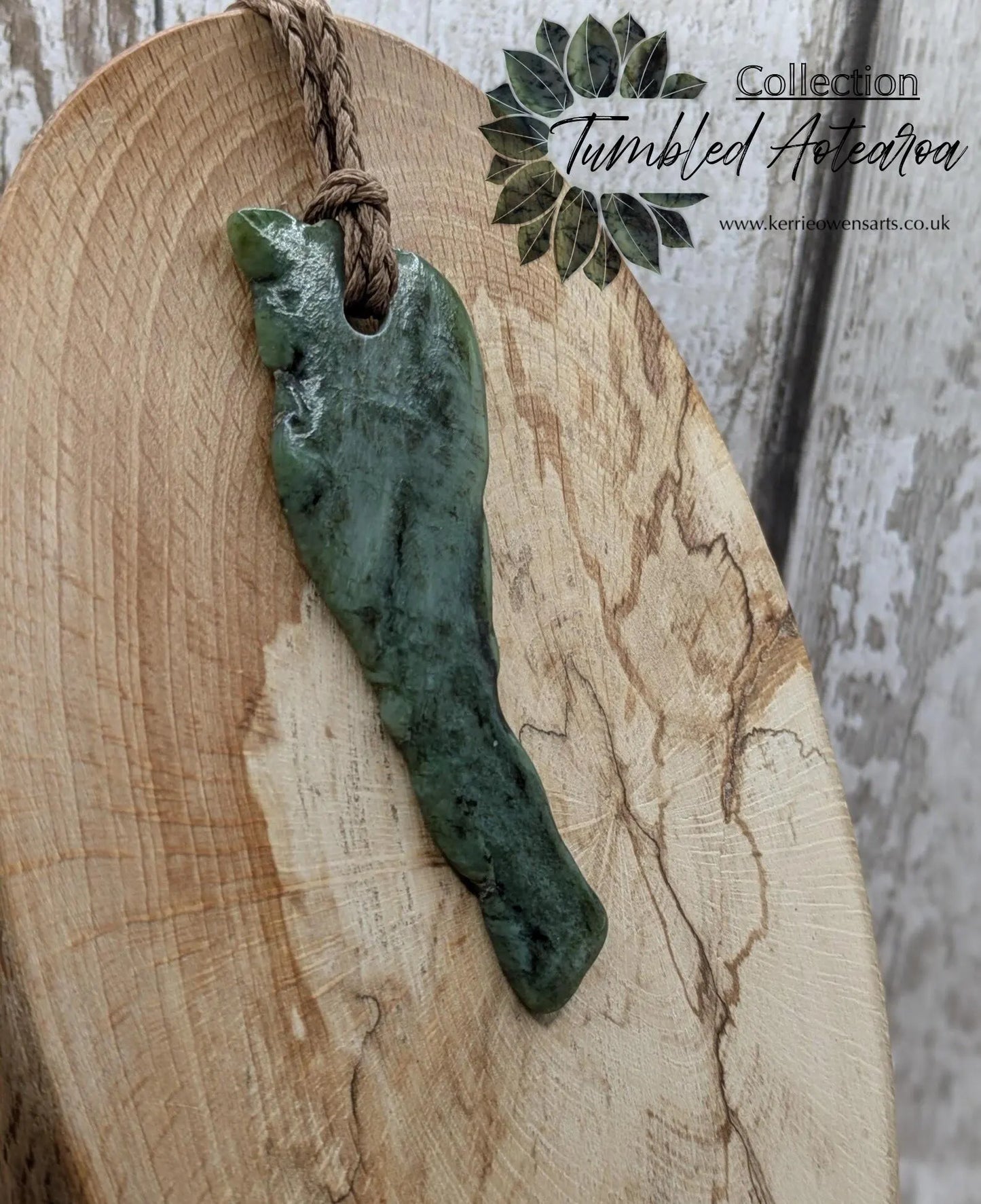 tumble polished New Zealand pounamu greenstone jade pendant.