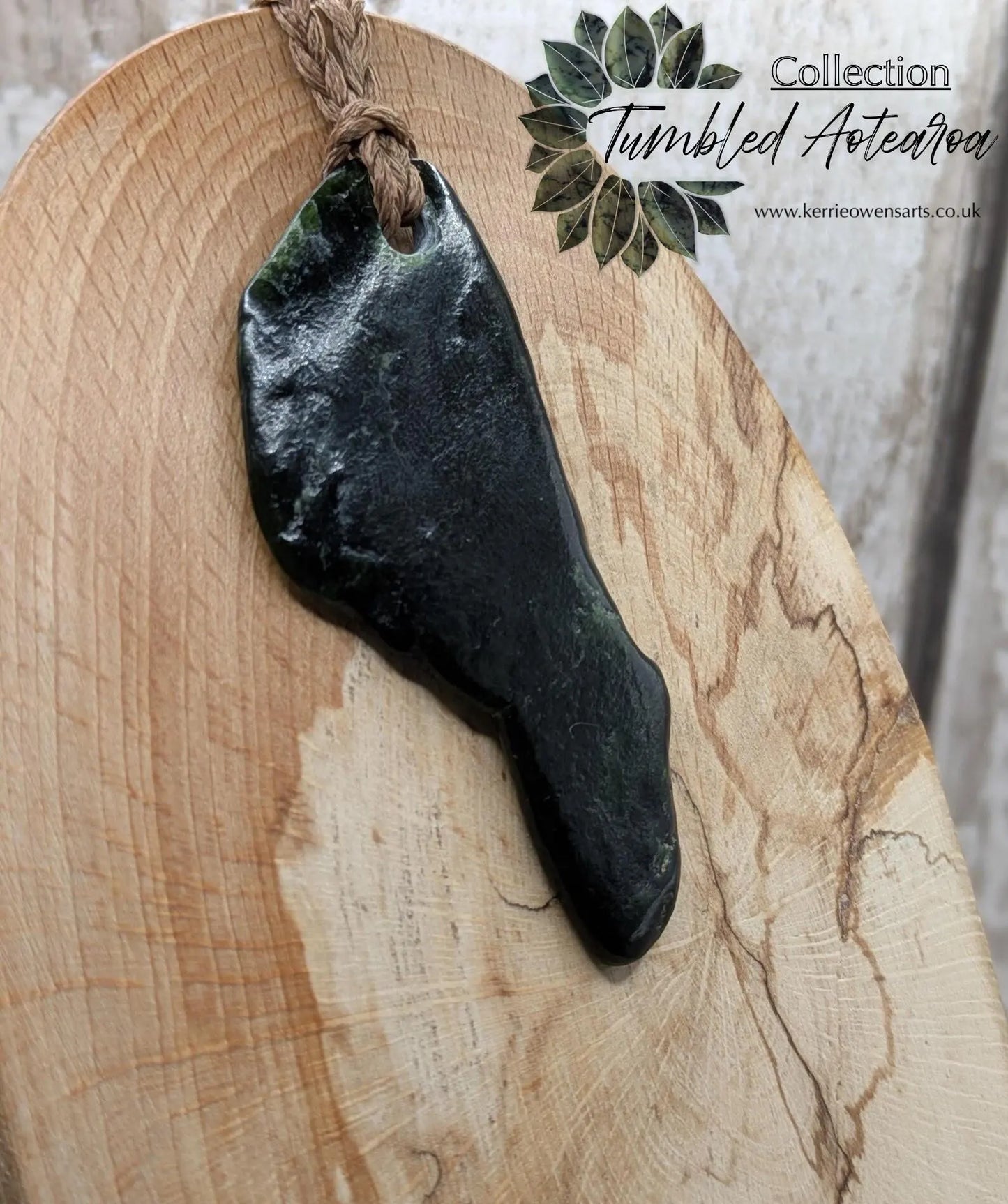 Tumble polished New Zealand greenstone jade pendant.
