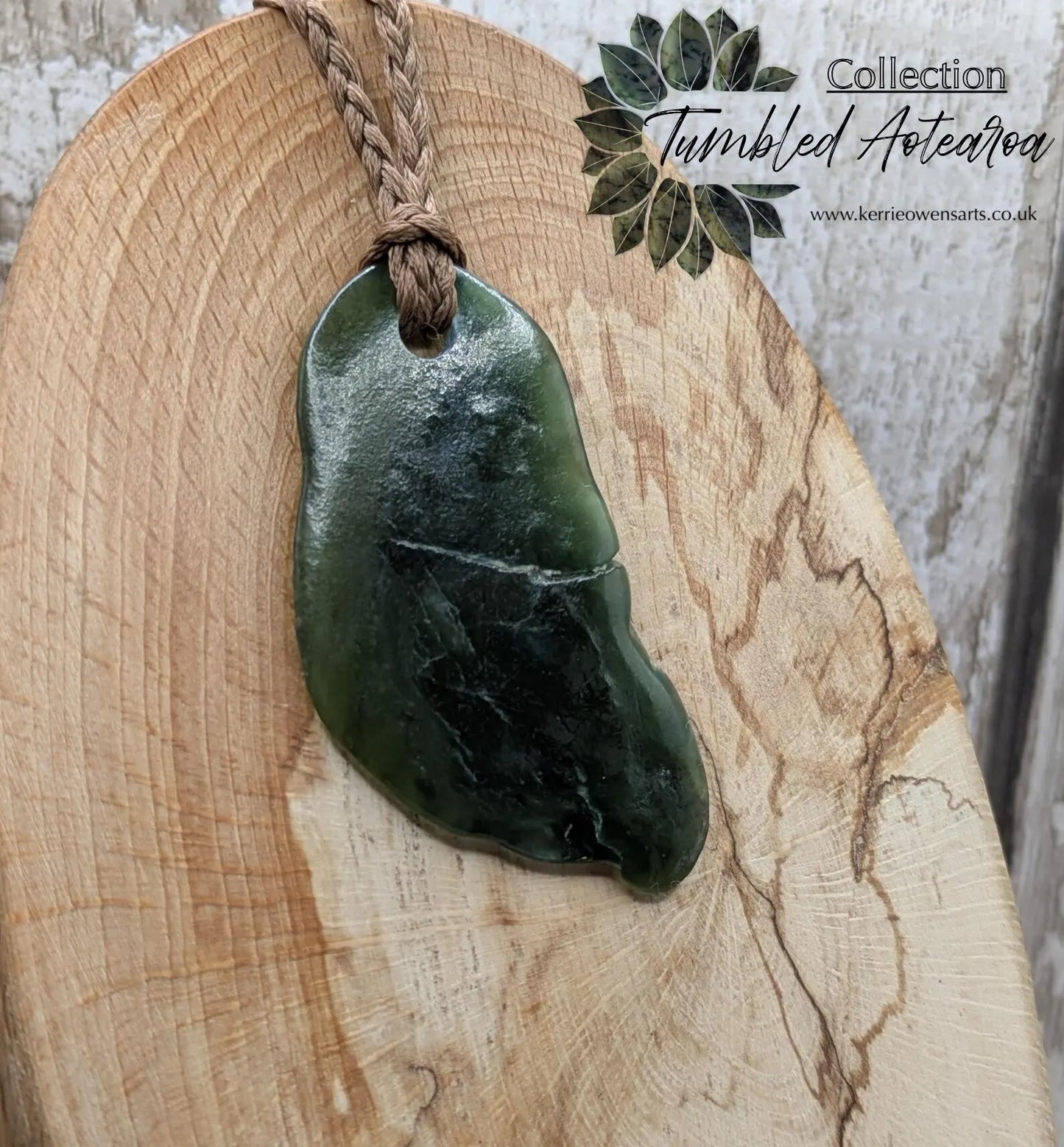 Tumbled polished New Zealand greenstone Pounamu jade pendant.