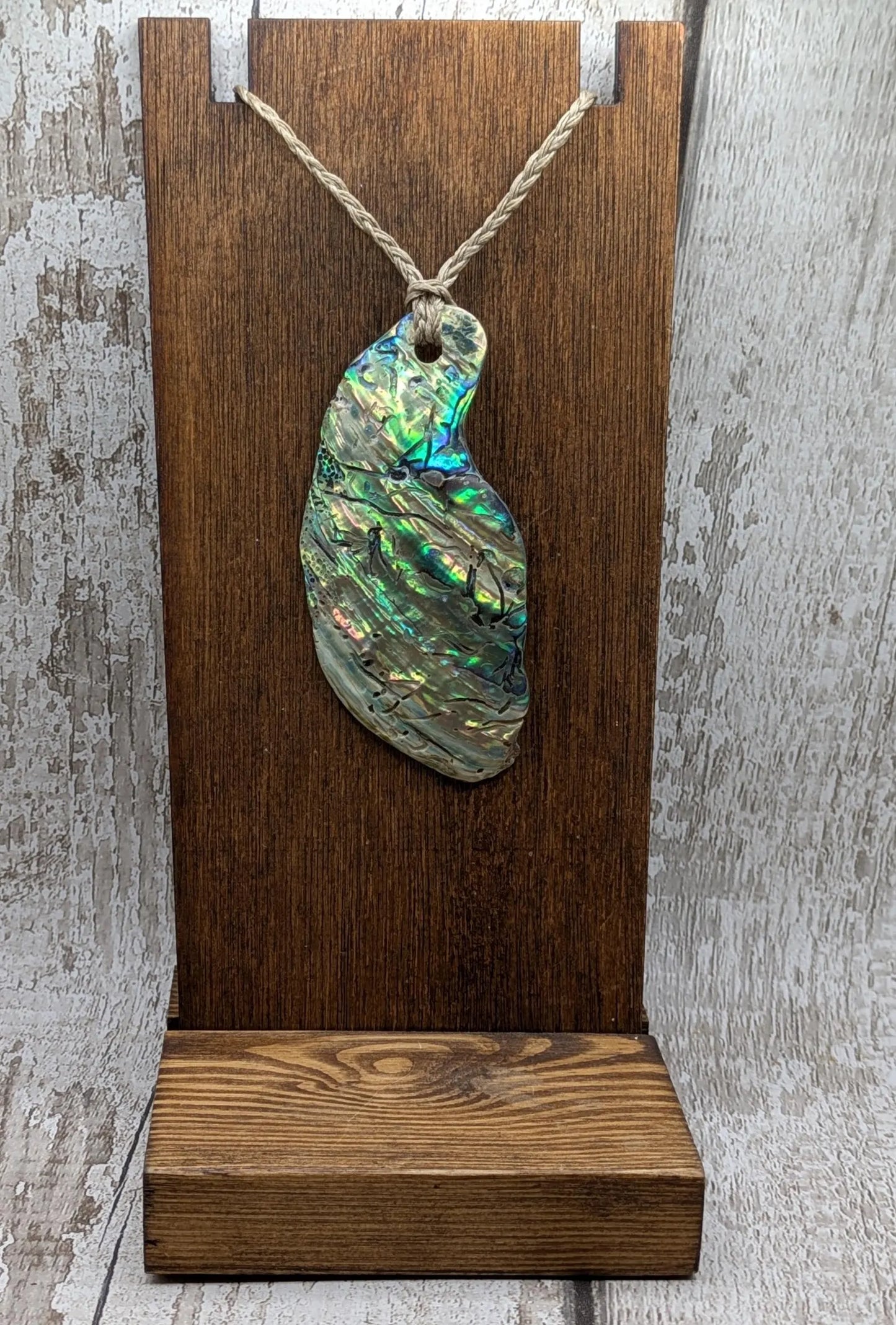 New Zealand free form naturally tumbled Pāua shell pendant.